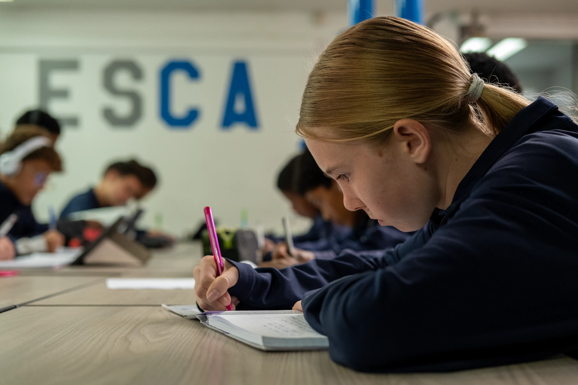 Esca Student Studying At Desk