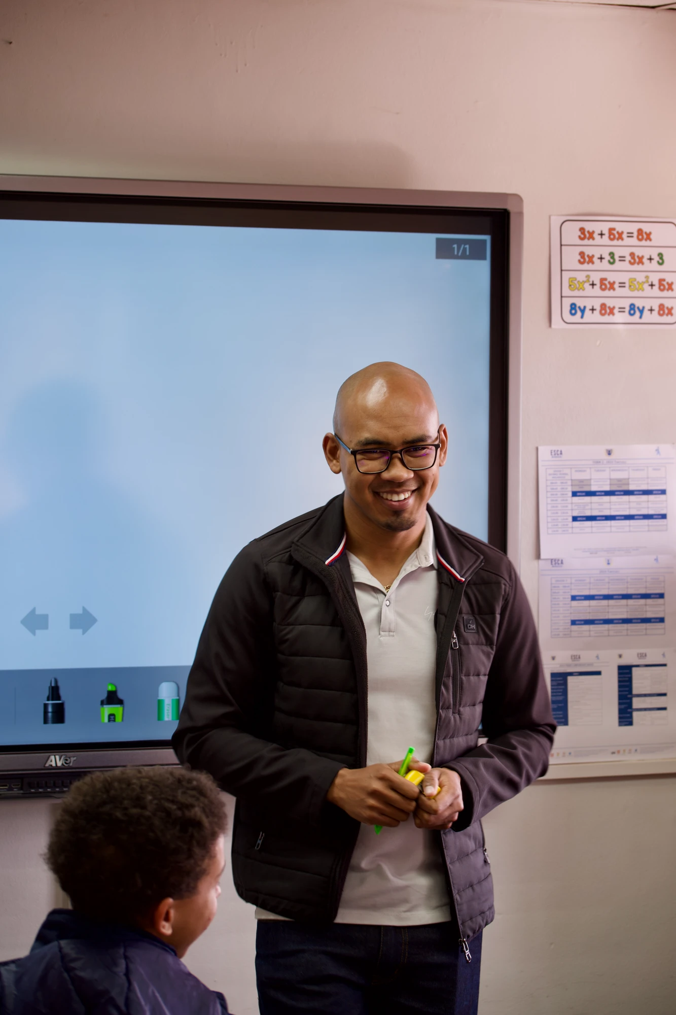 Esca Teacher Smiling In Classroom
