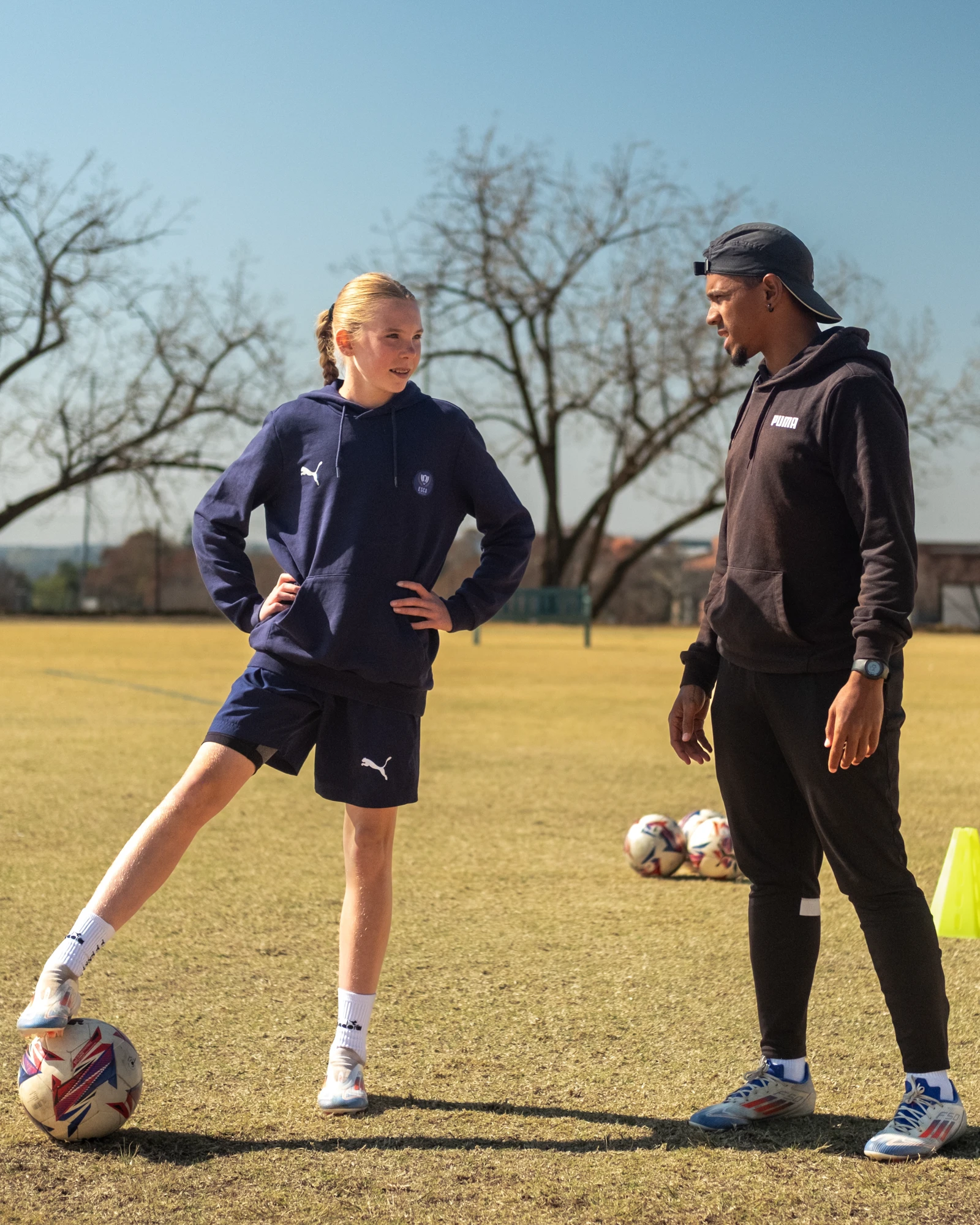 Esca Soccer Coach Giving Instructions
