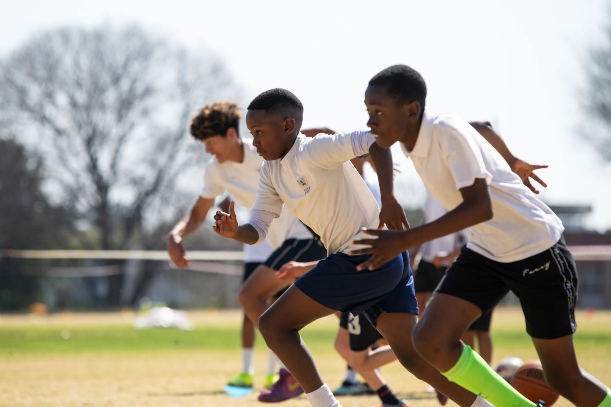 Esca Children Sprinting On Field