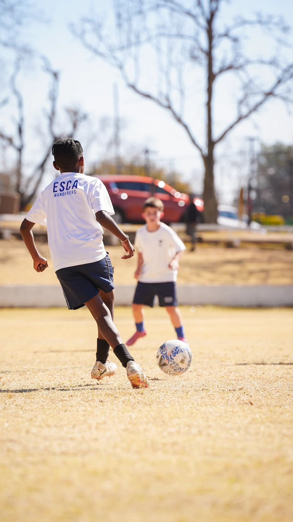Esca Kids Playing Soccer Outdoors