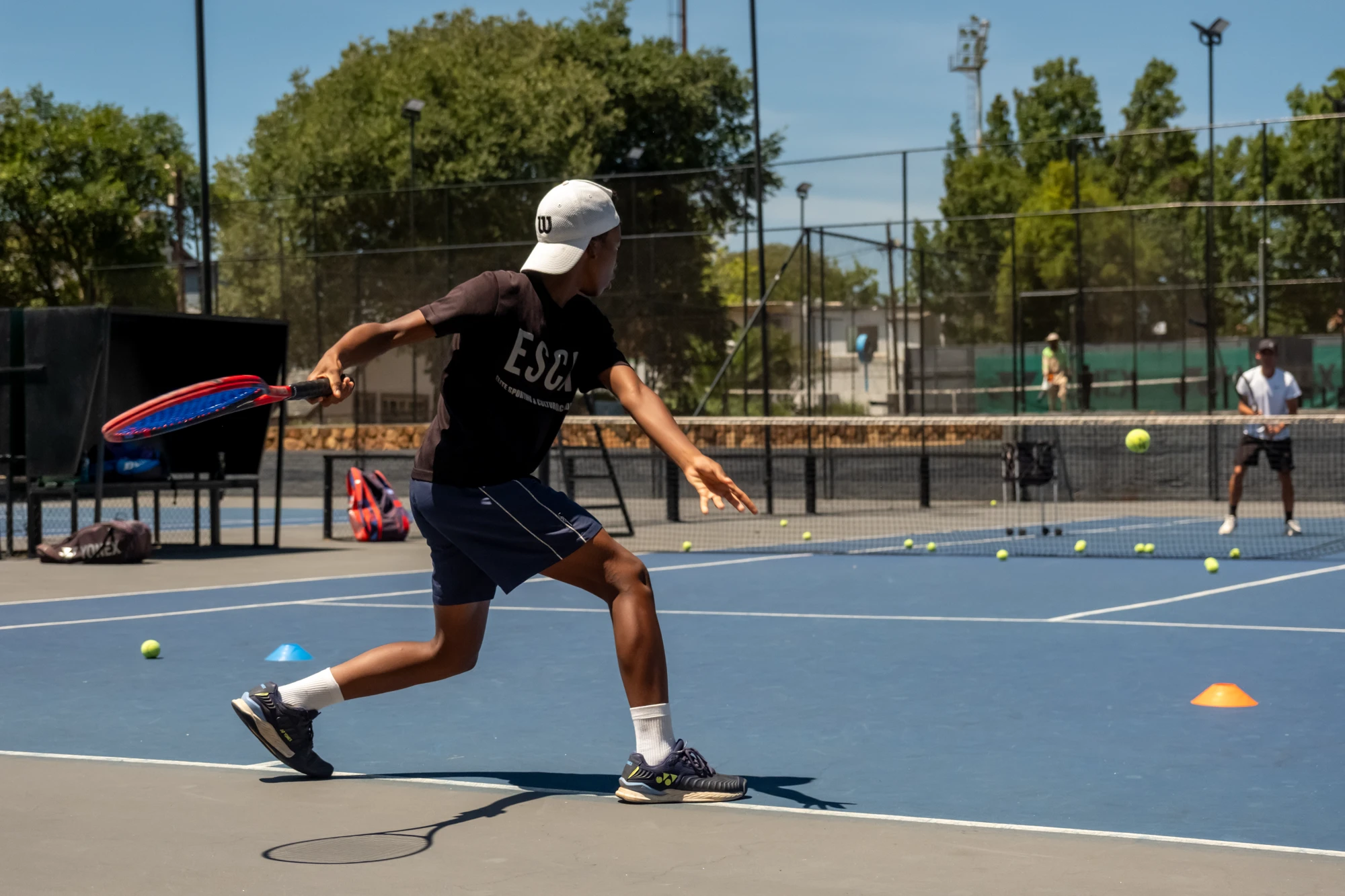 Esca Boy Playing Tennis On Court