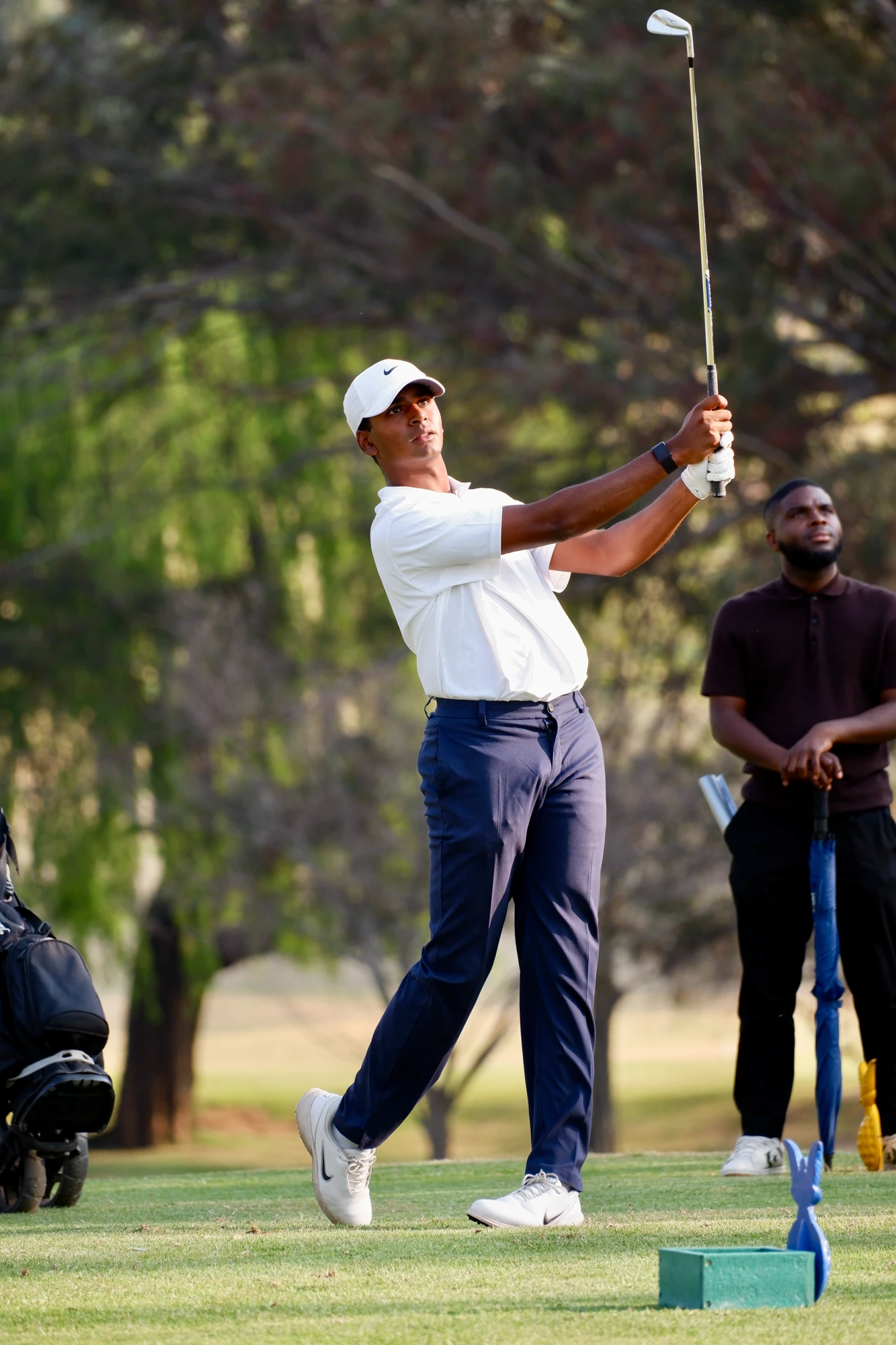 Esca Man Playing Golf On Course