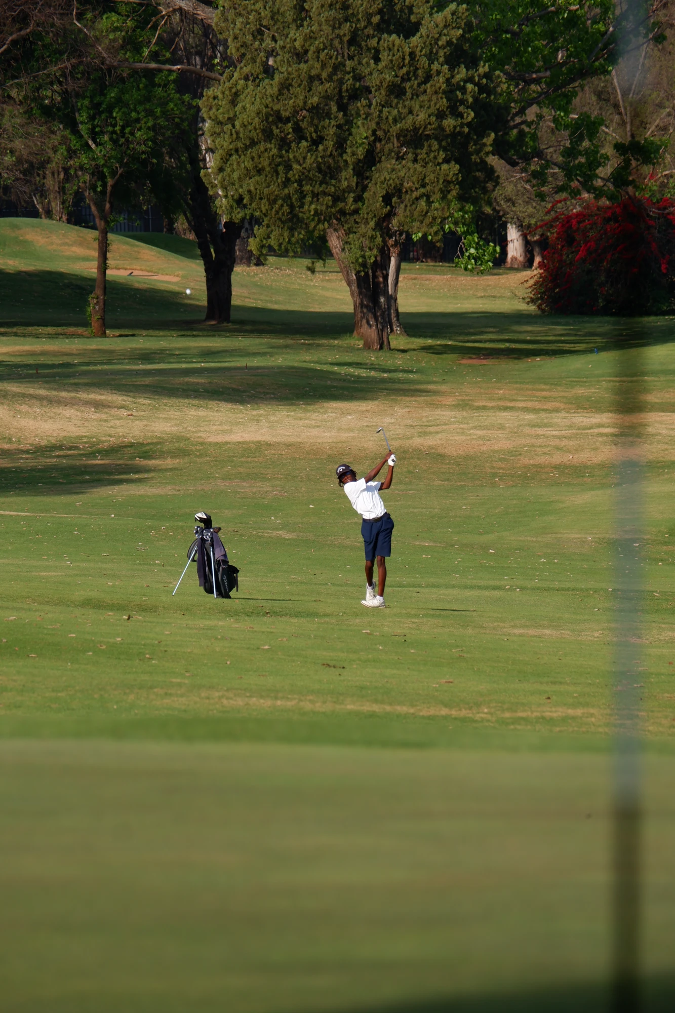 Esca Child Playing Golf On Course