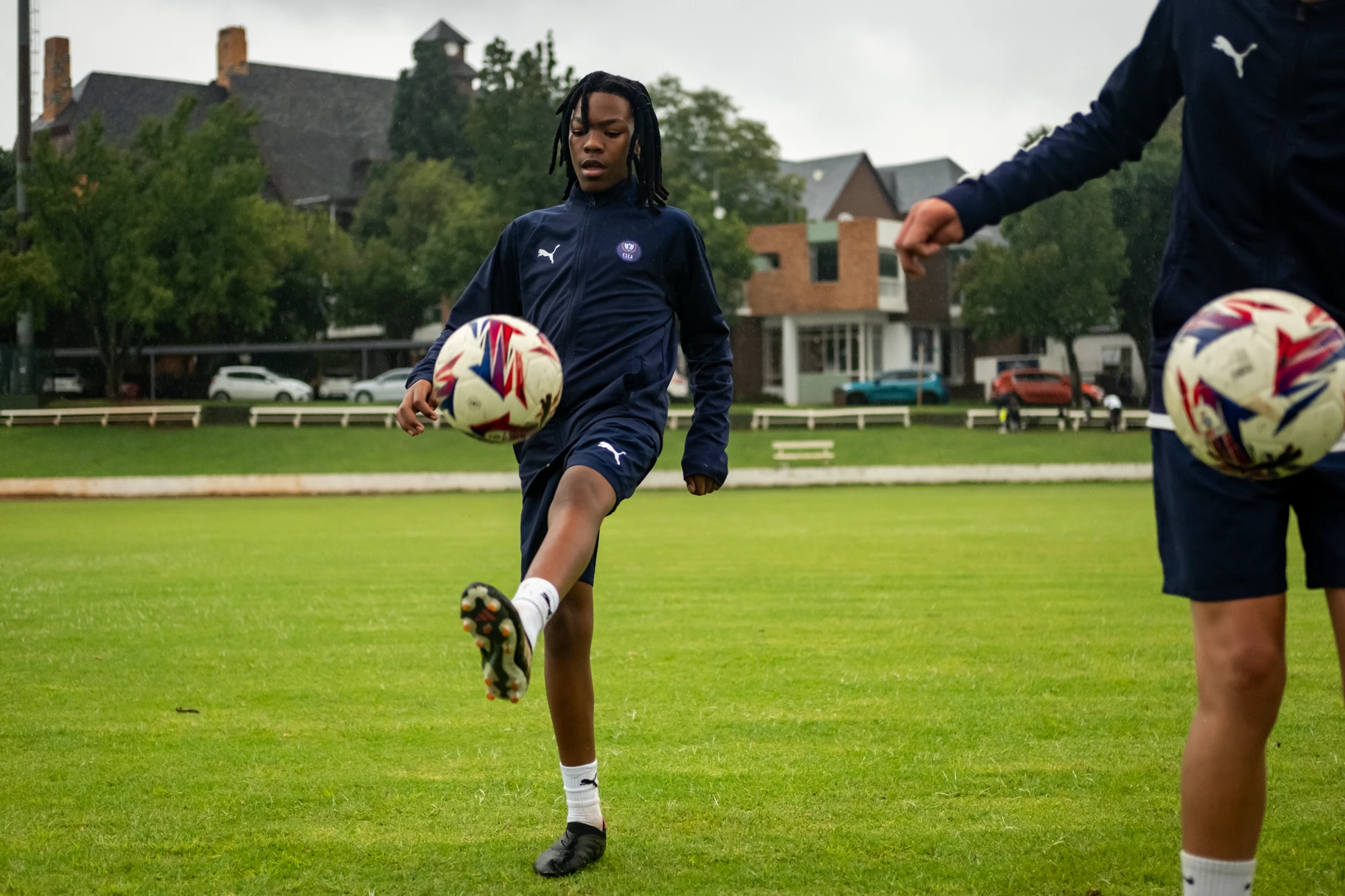 Esca Young Soccer Player Practicing On Field
