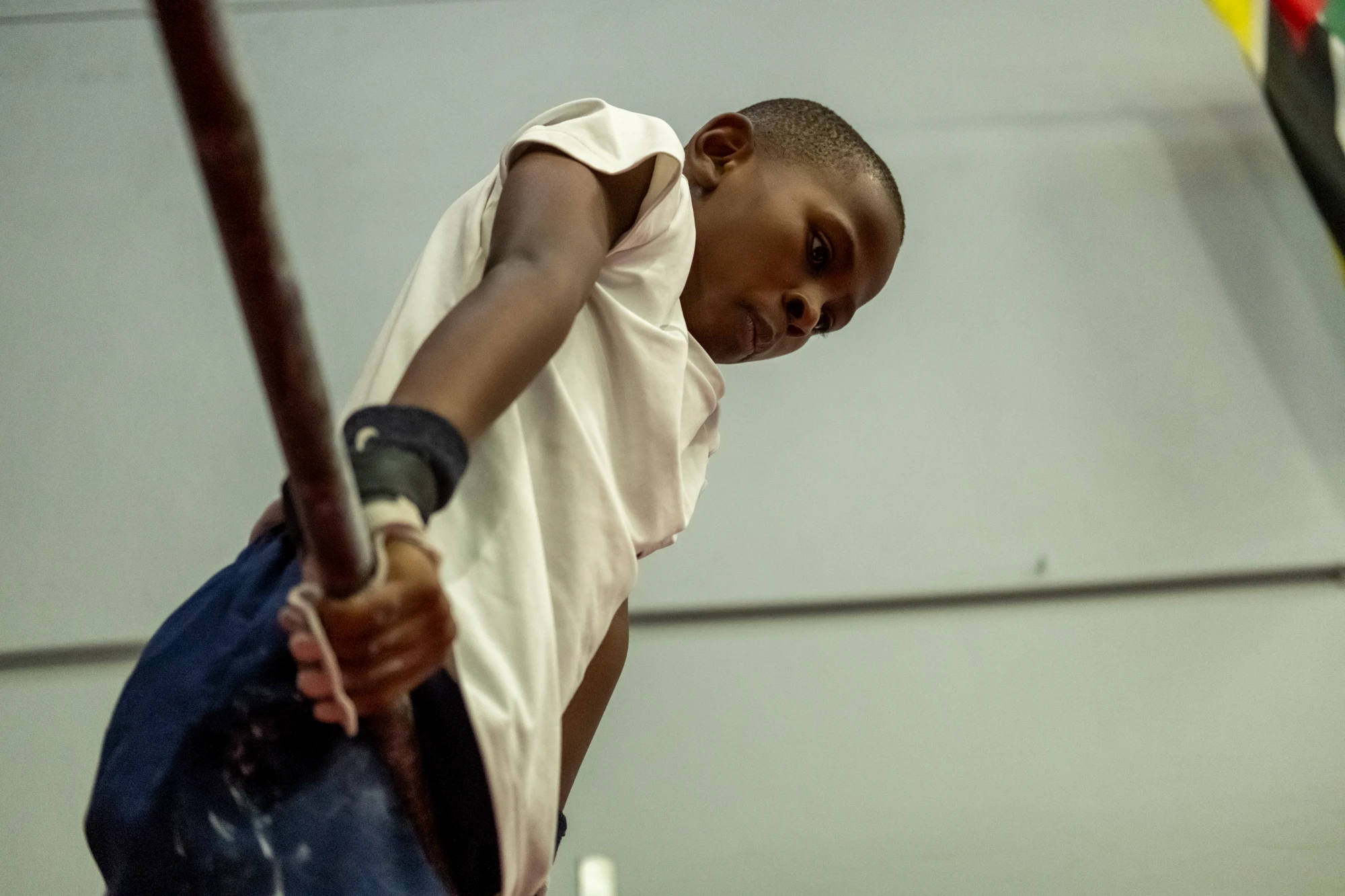 Esca Young Boy Climbing A Pole