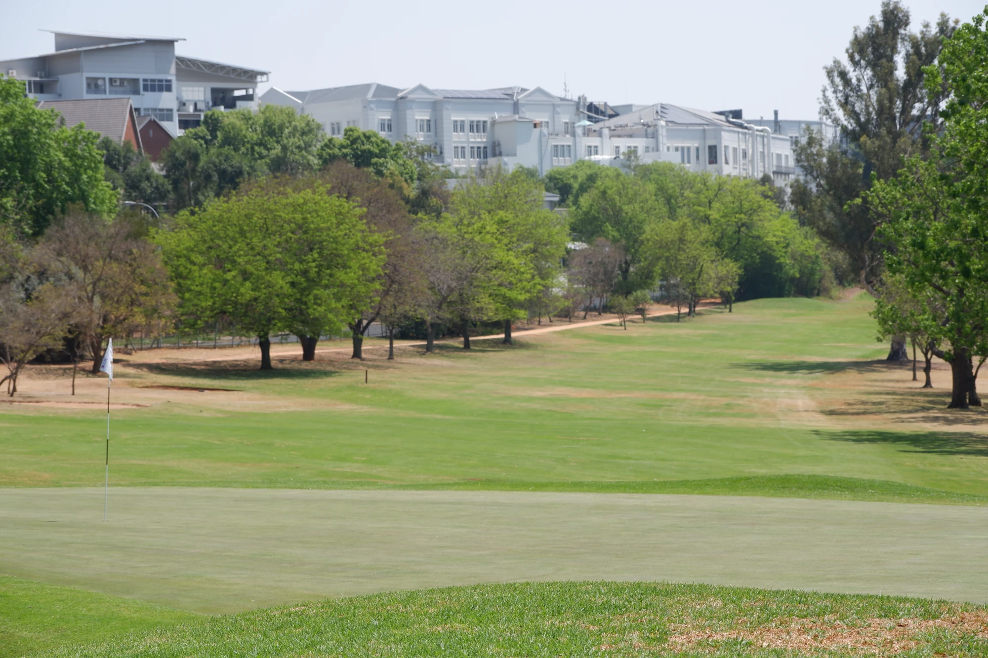 Esca Golf Course With Trees And Buildings