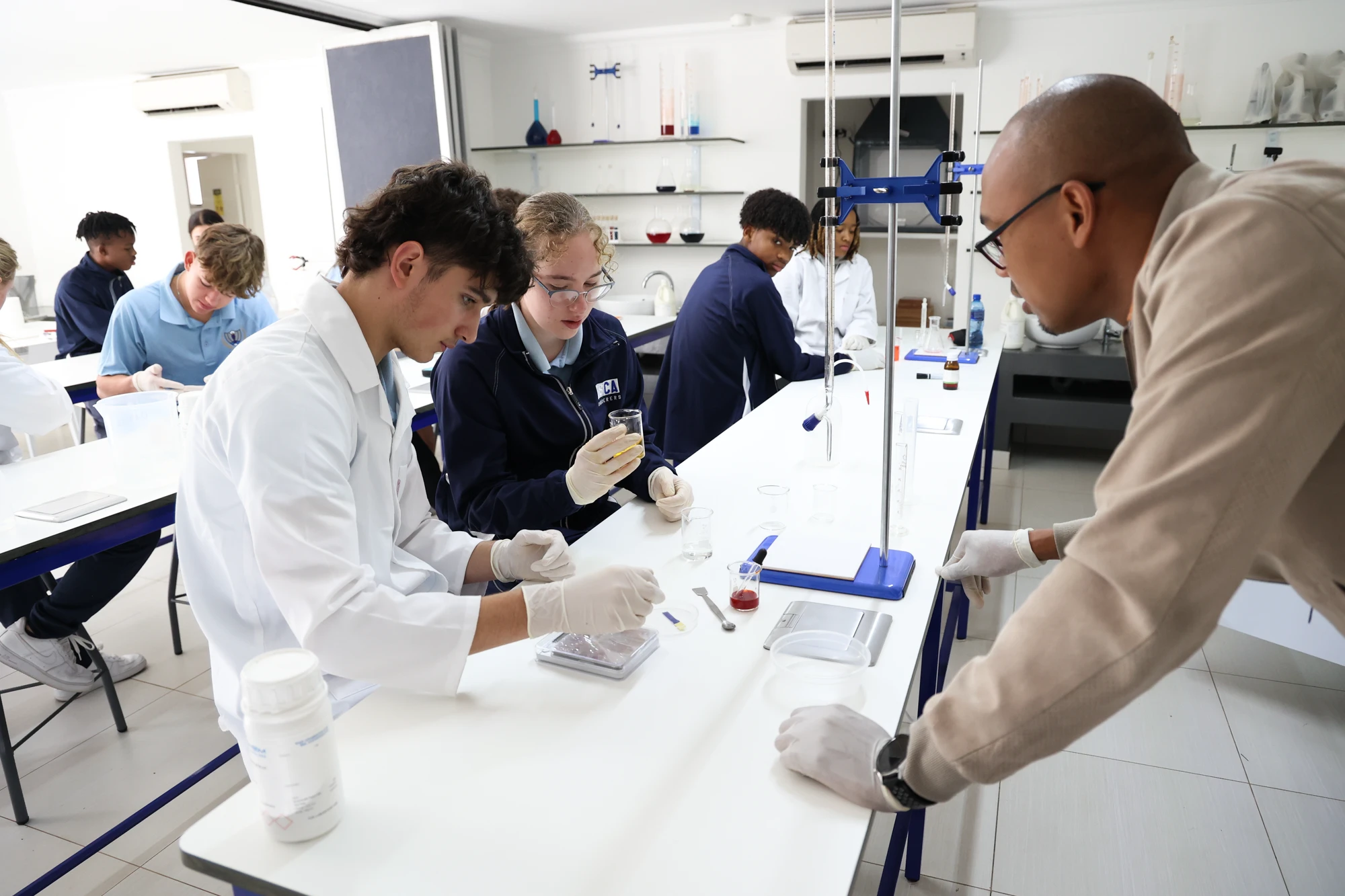 Esca Students Conducting Chemistry Experiment