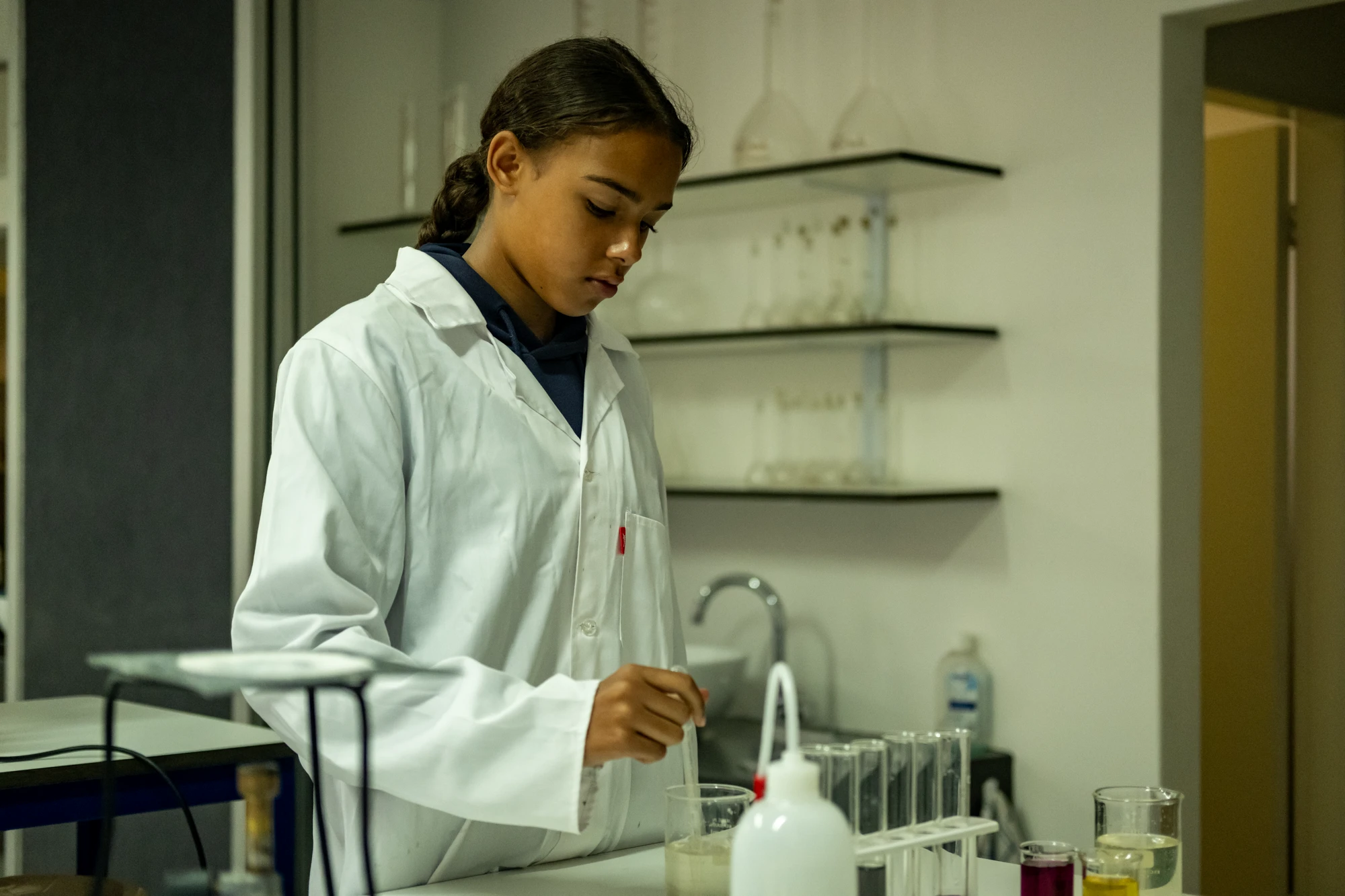 Esca Young Woman In Lab Coat Working