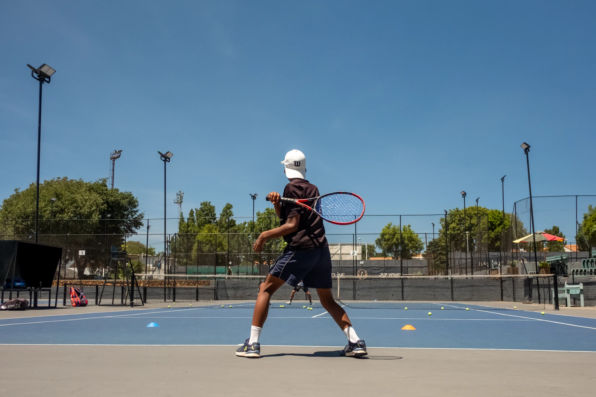 Esca Young Boy Playing Tennis Outdoors Wilson