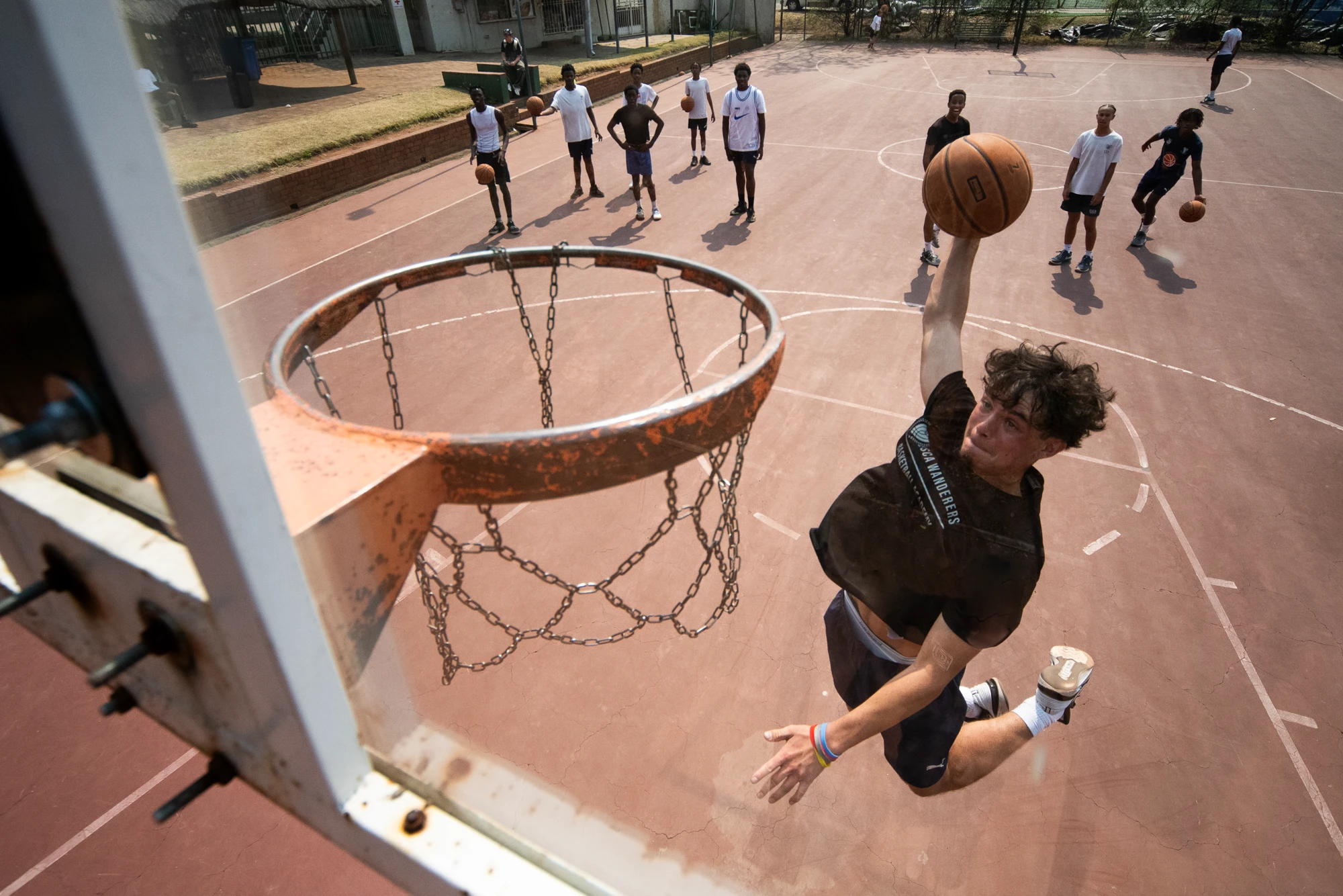 Esca Young Man Dunking Basketball