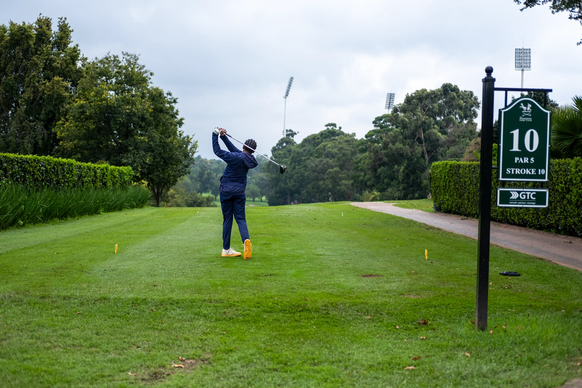 Esca Golf Player Teeing Off