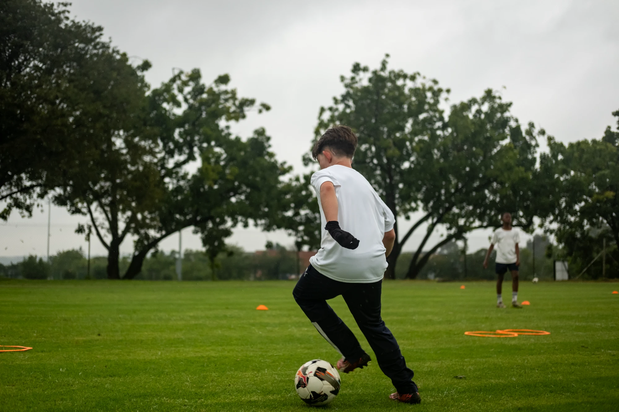 Esca Child Playing Soccer Outdoors