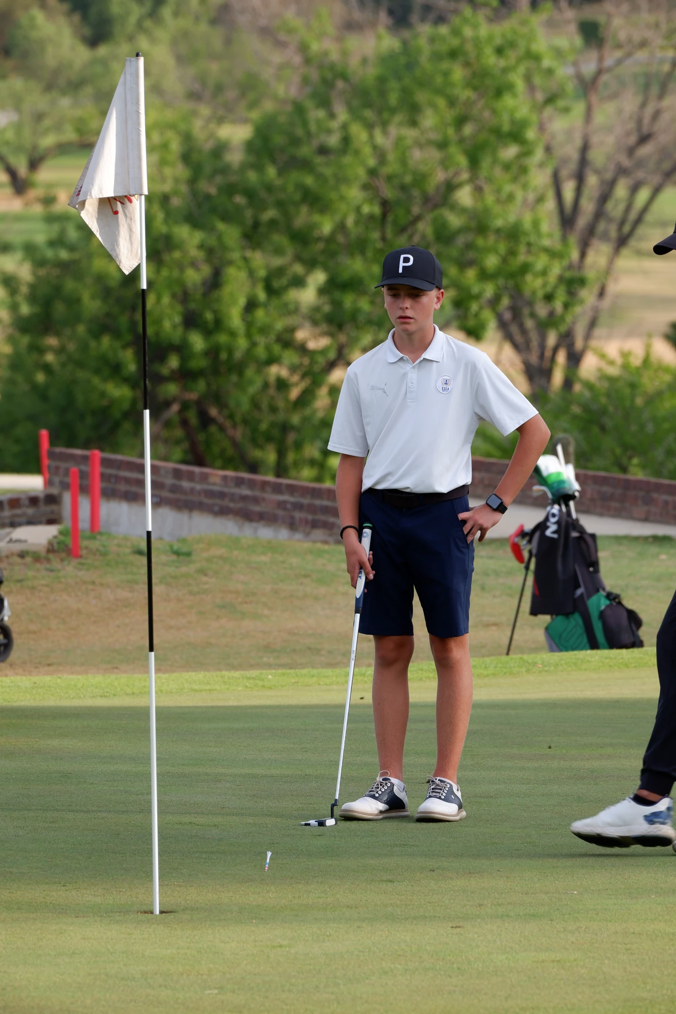 Esca Young Golfer On Putting Green