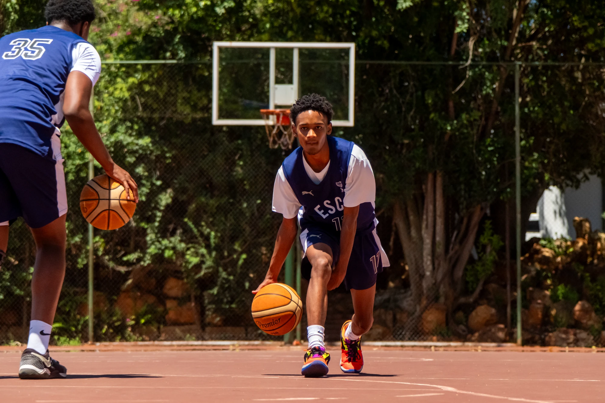 Esca Young Basketball Player Dribbling
