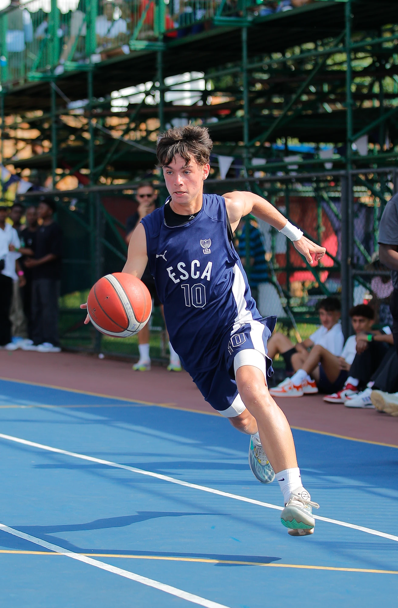 Esca Boy Playing Basketball On Court