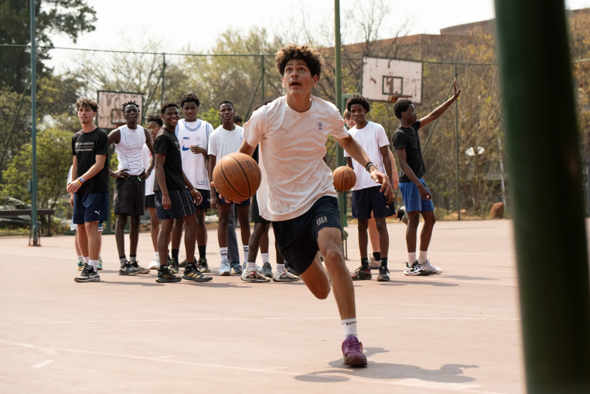 Esca Young Man Running With Basketball
