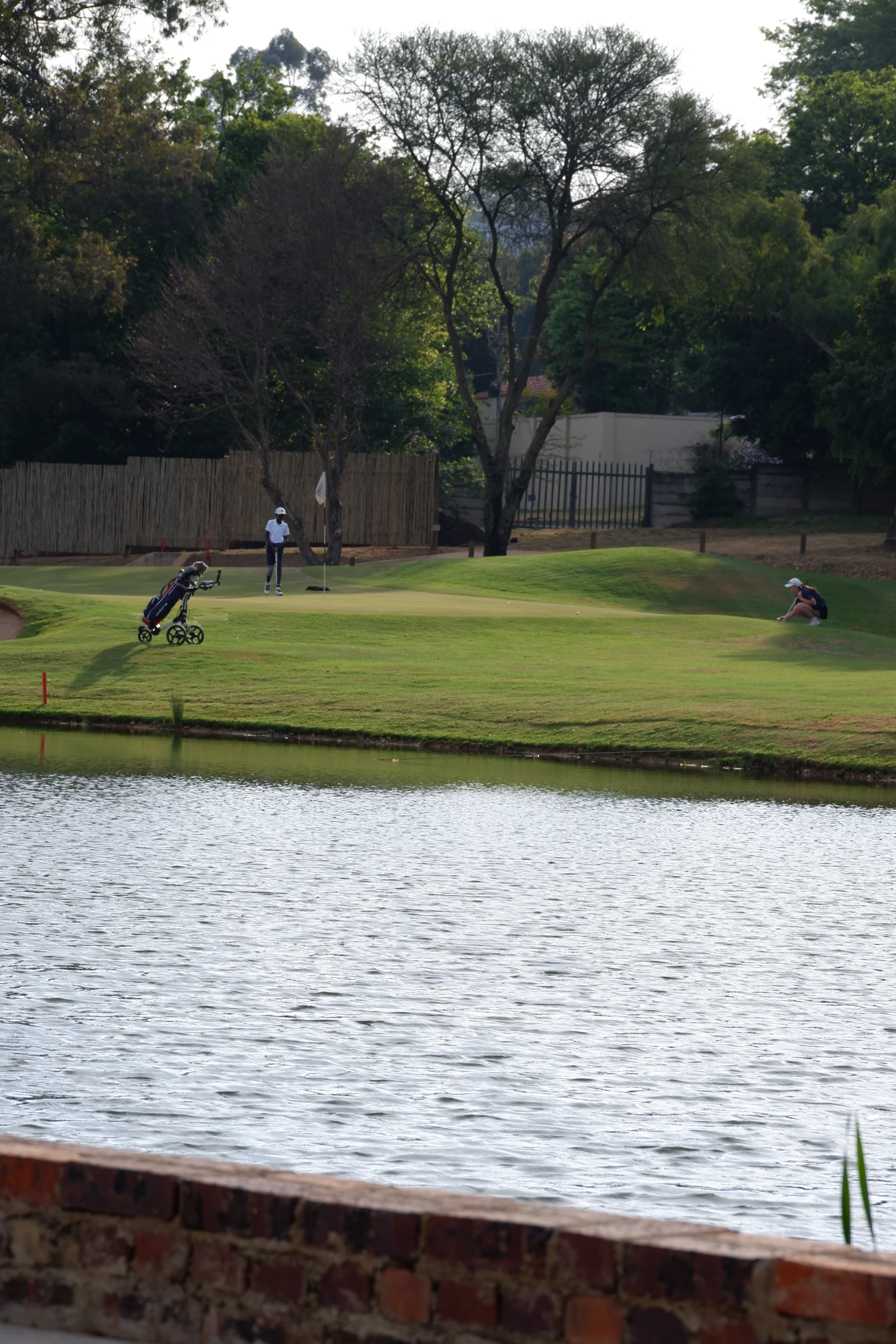 Esca Golf Course Near Water People Playing