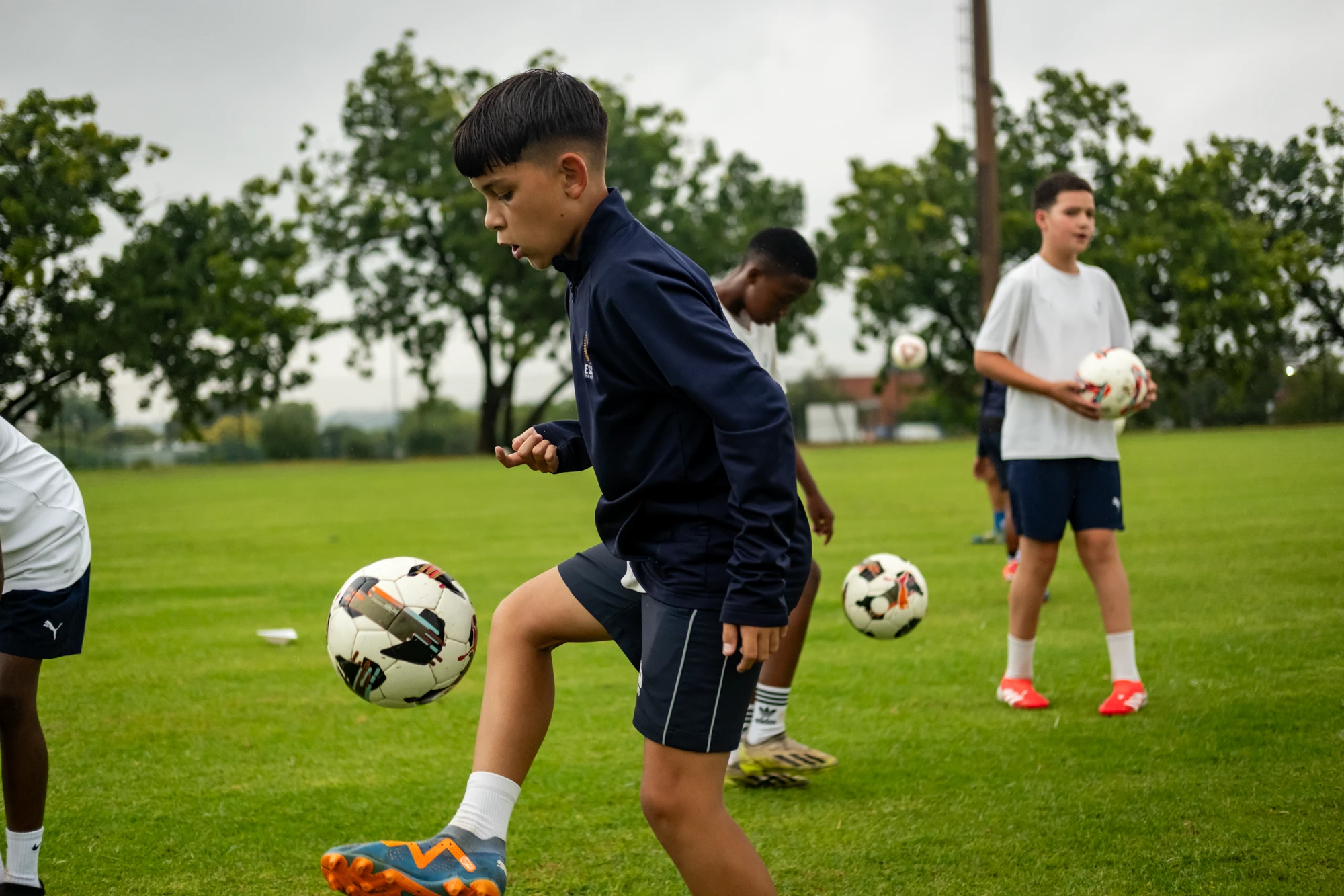 Esca Kids Practicing Soccer Outdoors