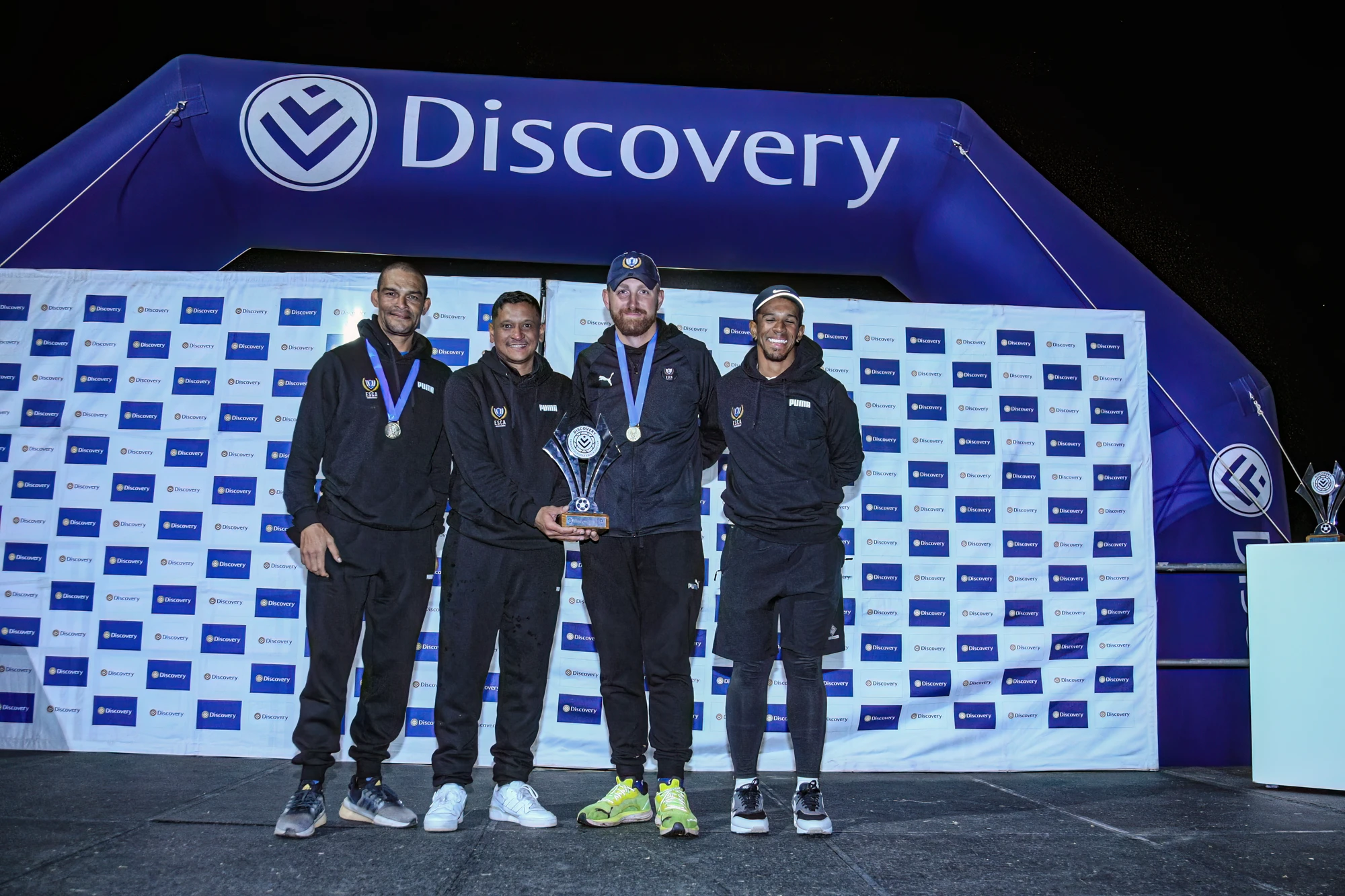 Esca Group Of Men Celebrating Victory