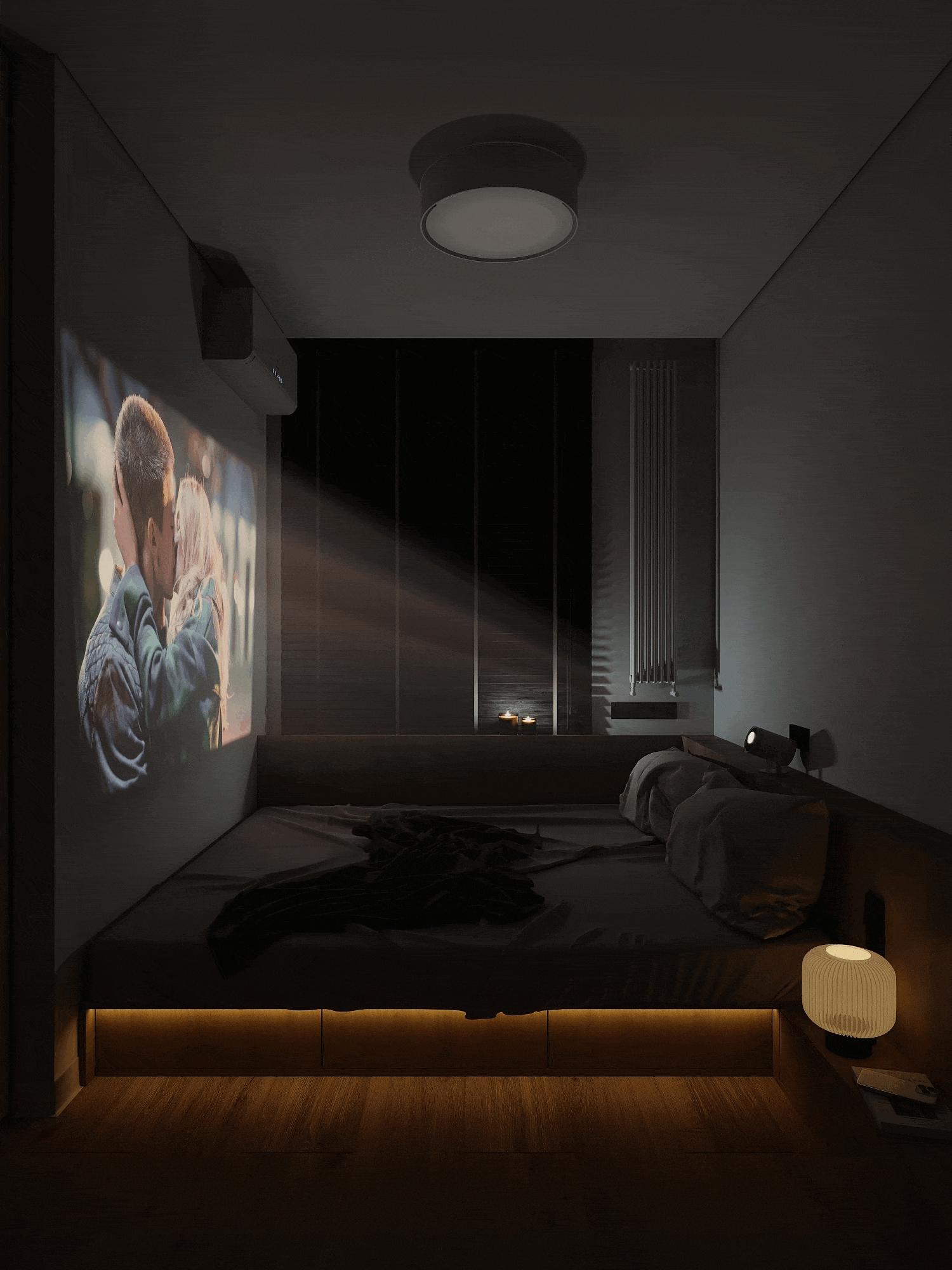 Dark bedroom with a projector displaying a kissing couple on the wall, ambient lighting under the bed, and a bedside lamp.