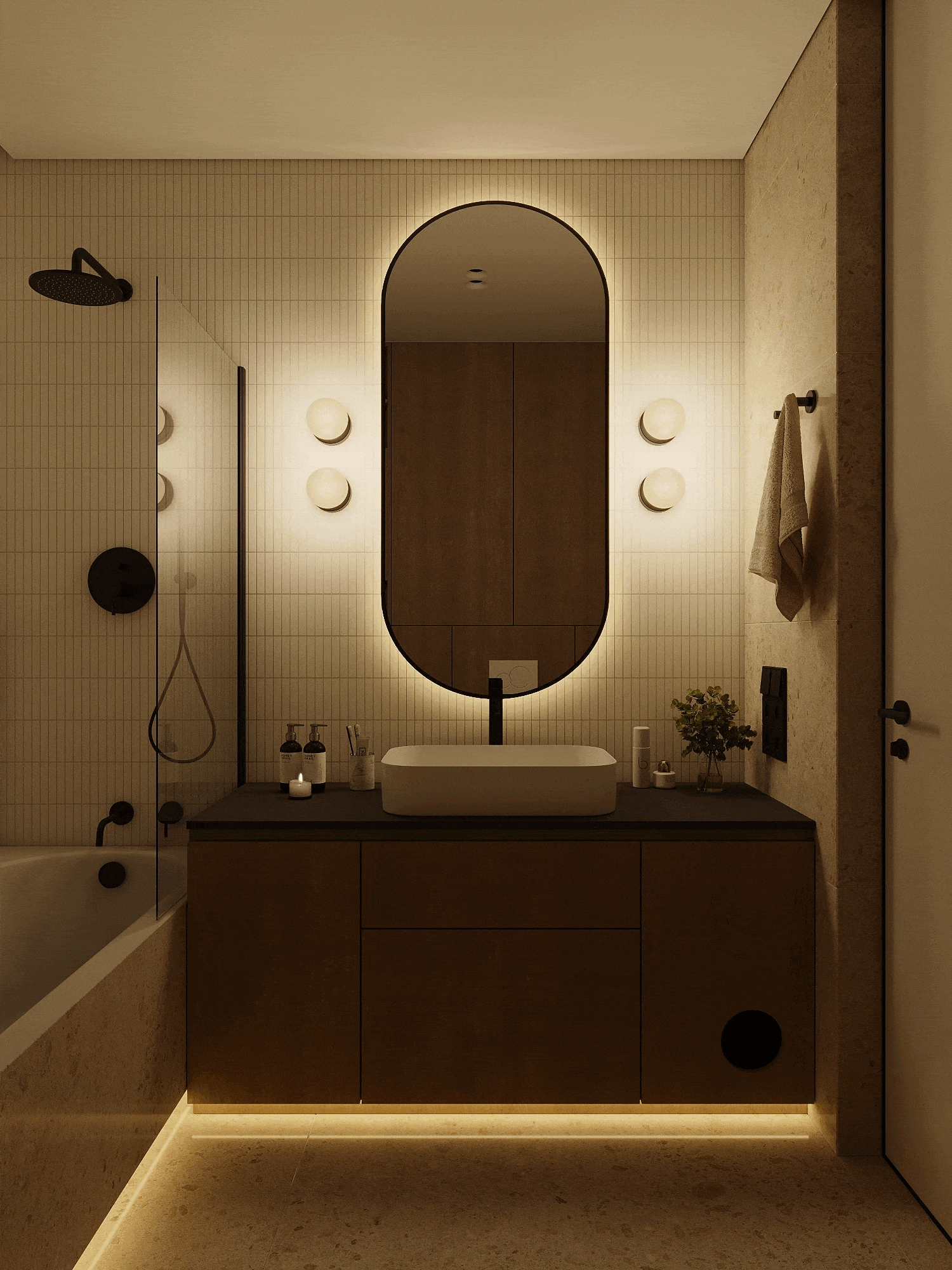 Modern bathroom vanity with illuminated oval mirror, dark countertop, vessel sink, and warm under-cabinet lighting.