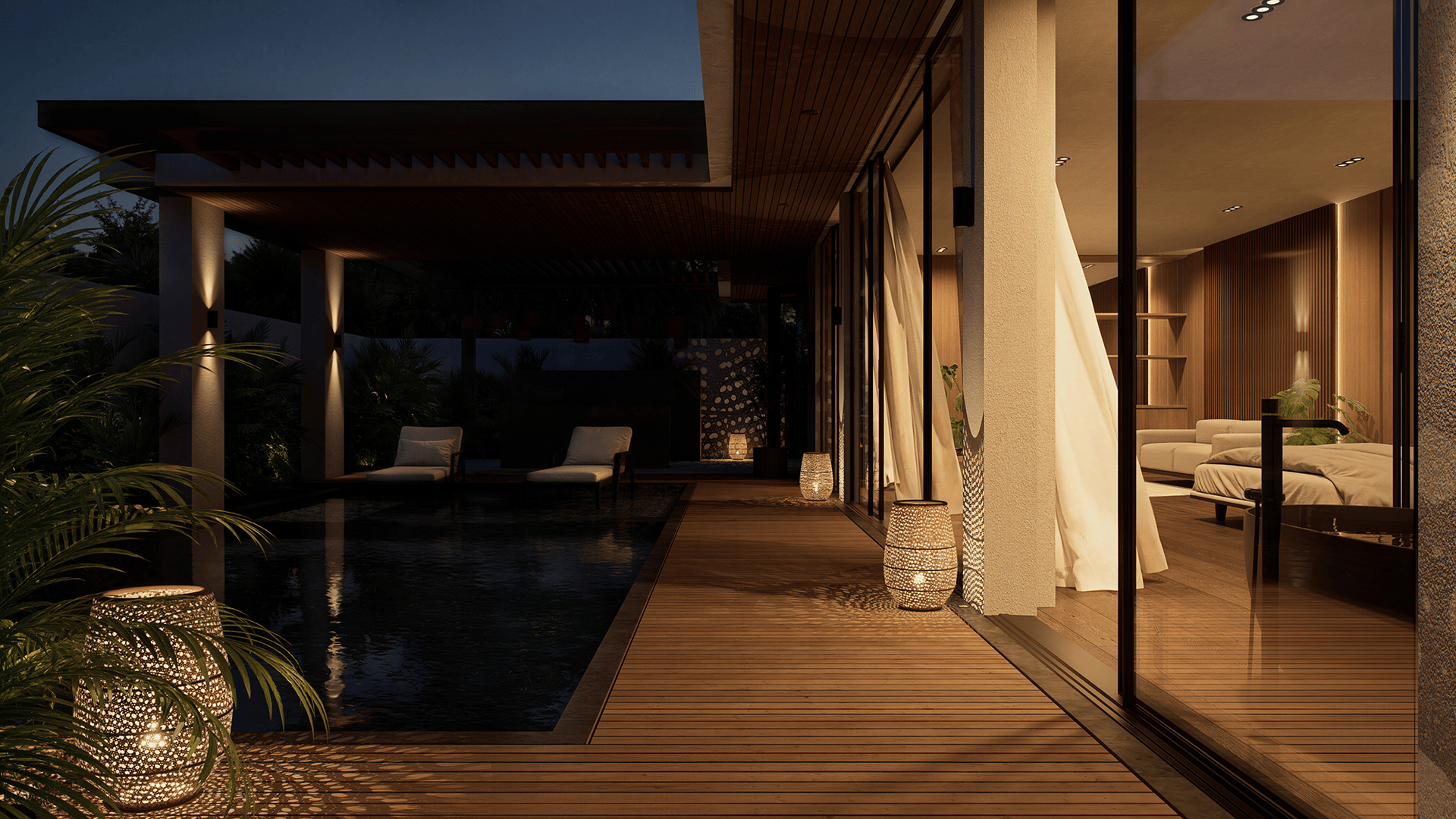 Night view of a modern outdoor wooden deck with lit lanterns, a pool, two lounge chairs, and a bedroom visible through large glass doors.