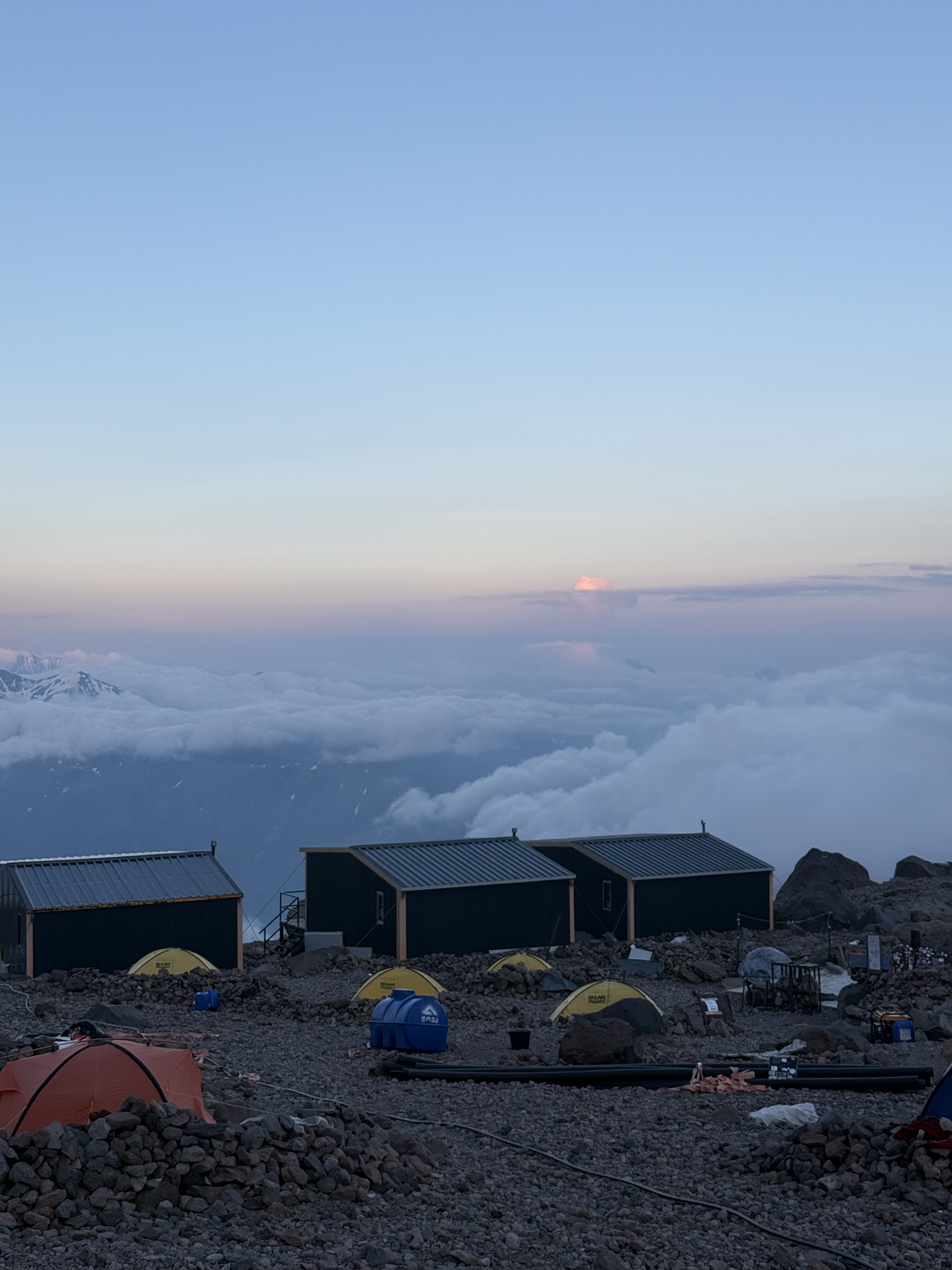 Camp above the clouds at dusk