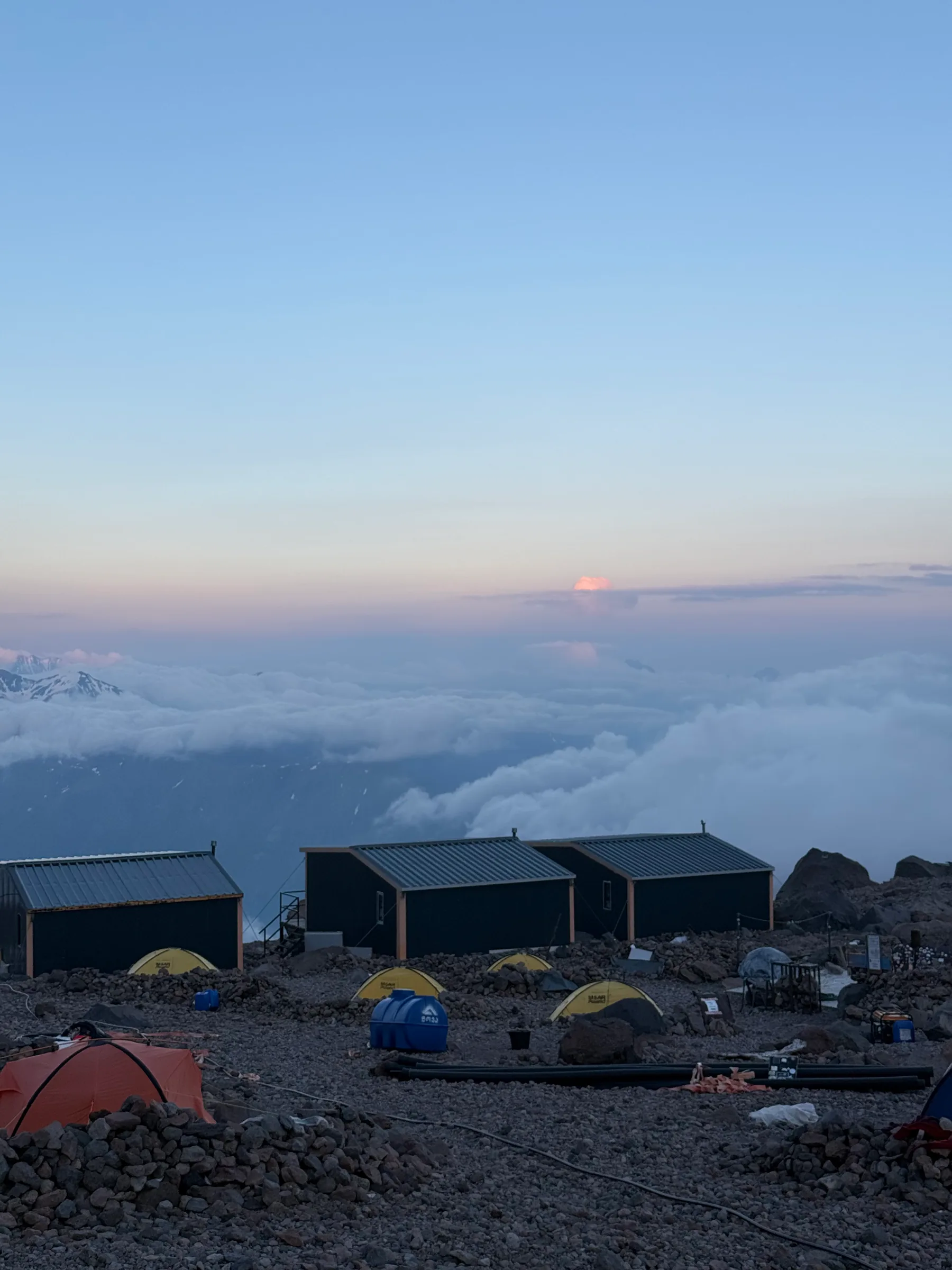 Camp above the clouds at dusk