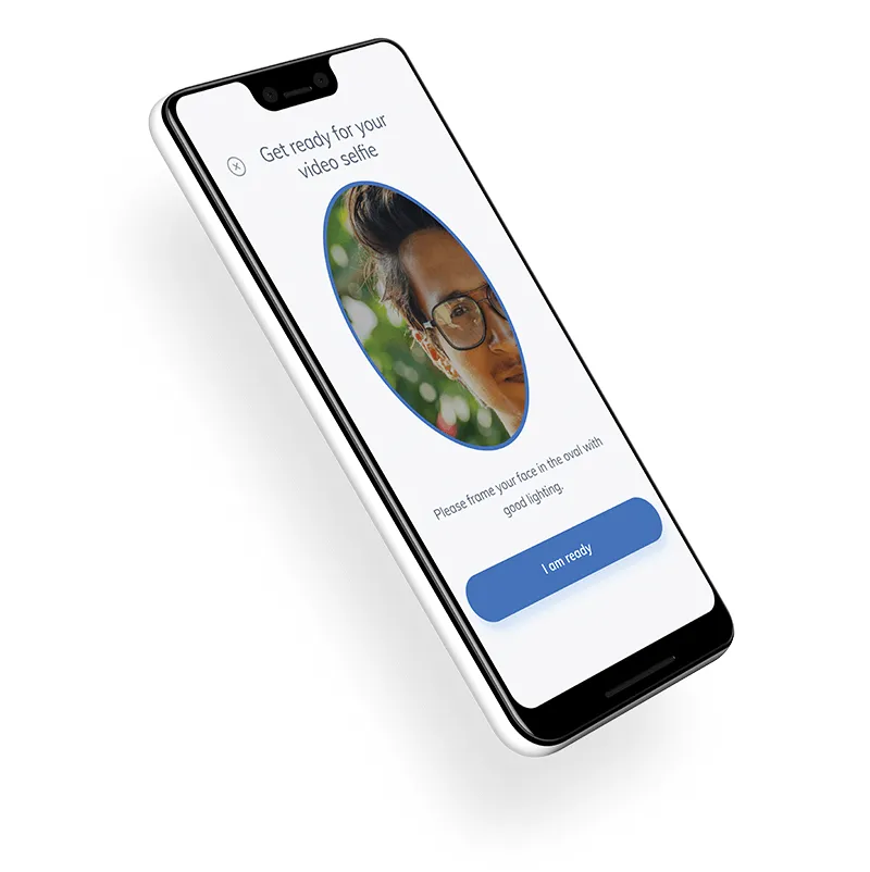 A cell phone with a picture of a man's face on the screen.