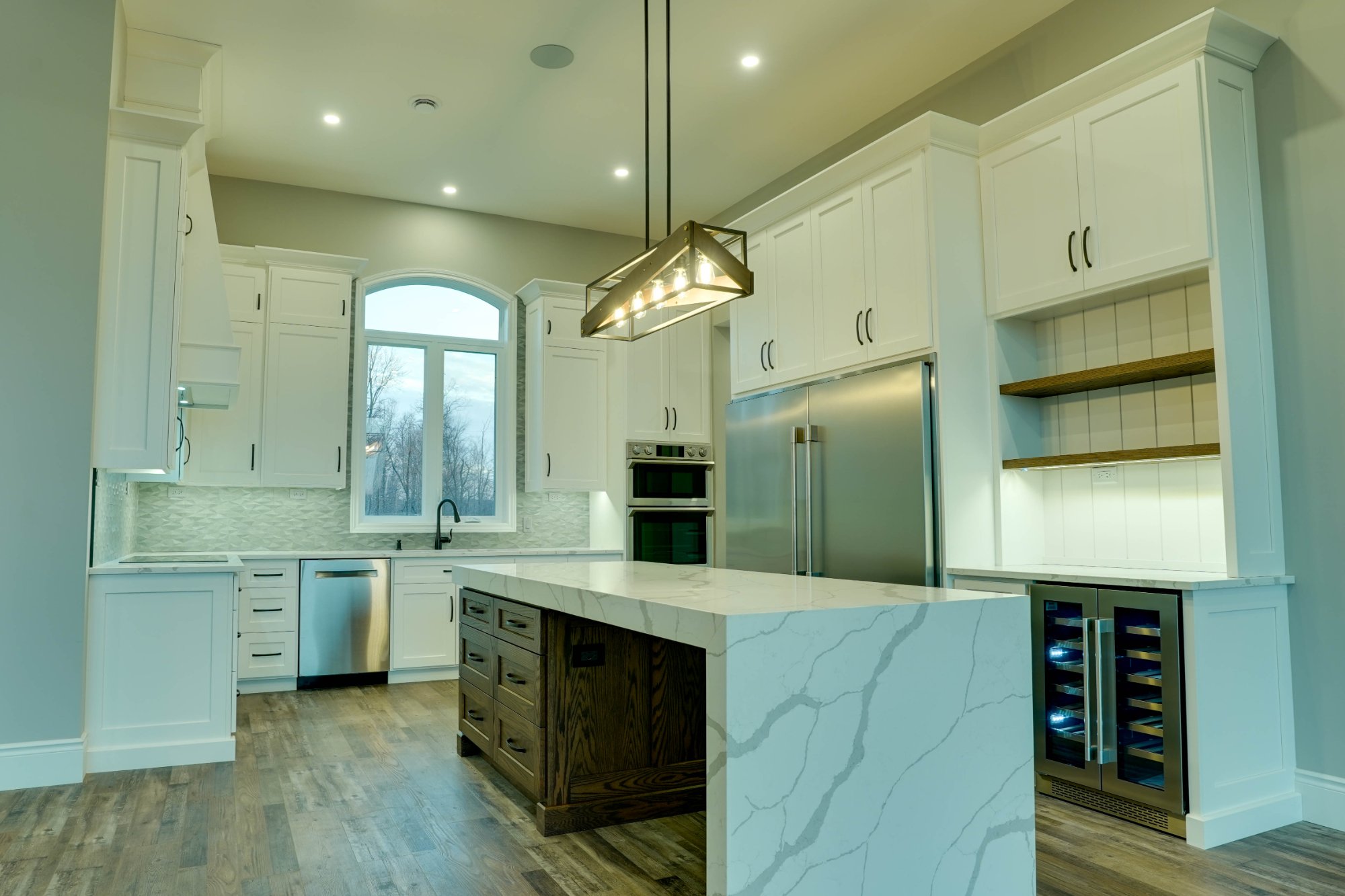 Veracious Developments kitchen with island quartz countertop and wine fridge