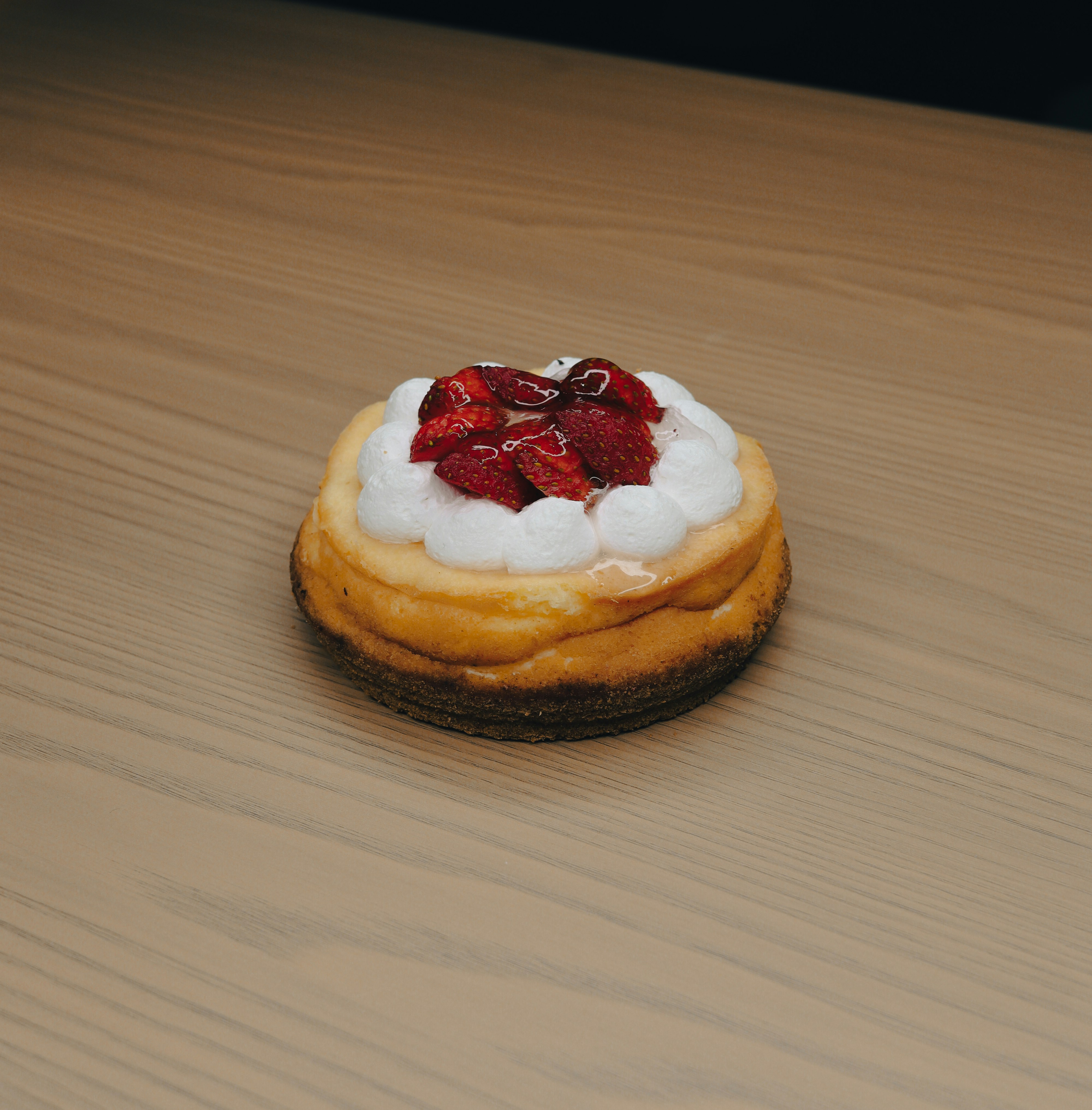 Mixing matcha with bamboo whisk, next to organic matcha package