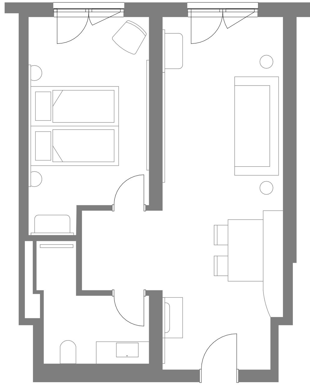 Grundriss einer Suite mit Schlafzimmer mit zwei Einzelbetten, Wohnzimmer mit Sofa und Esstisch, sowie Badezimmer.