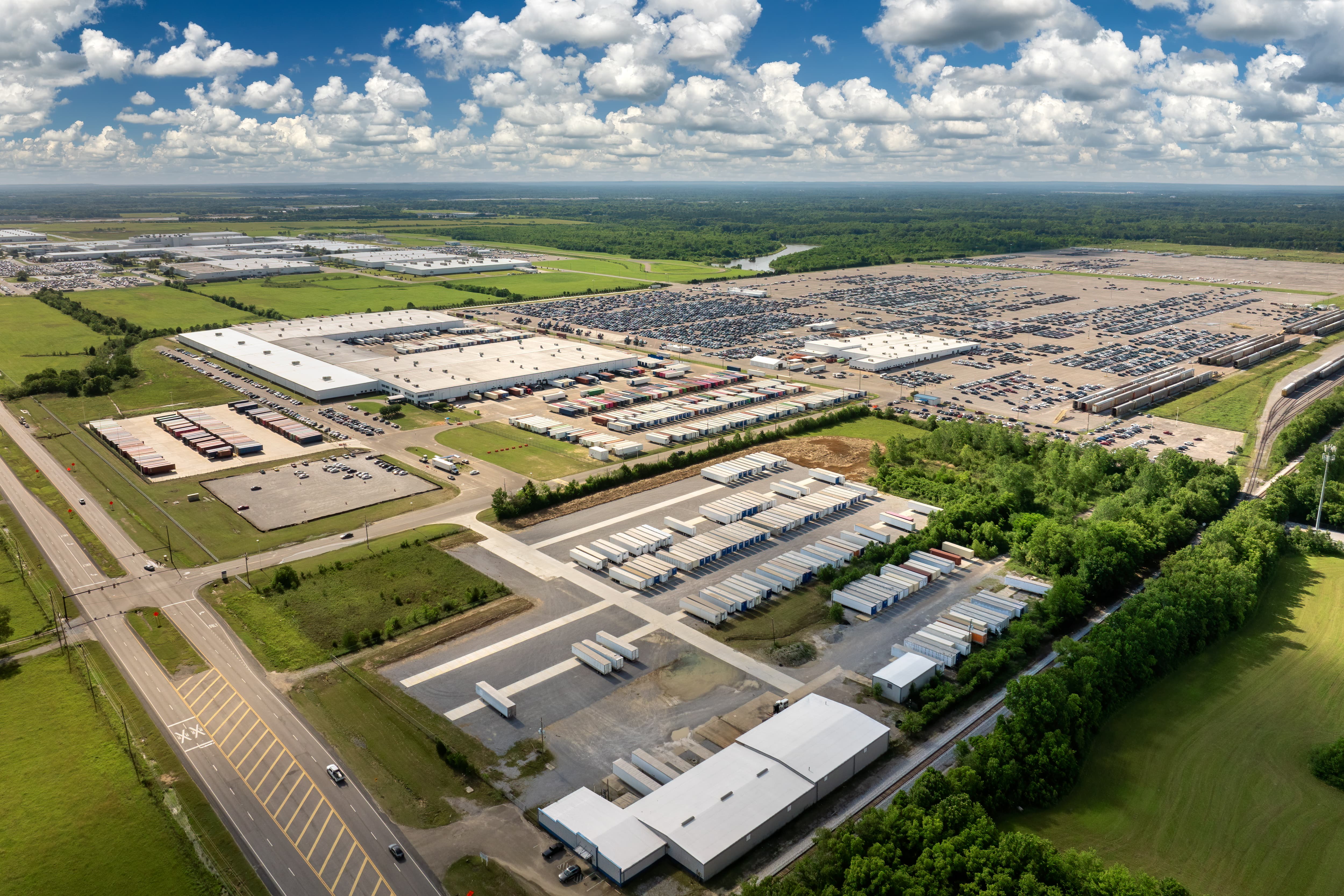 Curved white concrete architecture against a clear blue sky, showcasing smooth lines and modern design elements.