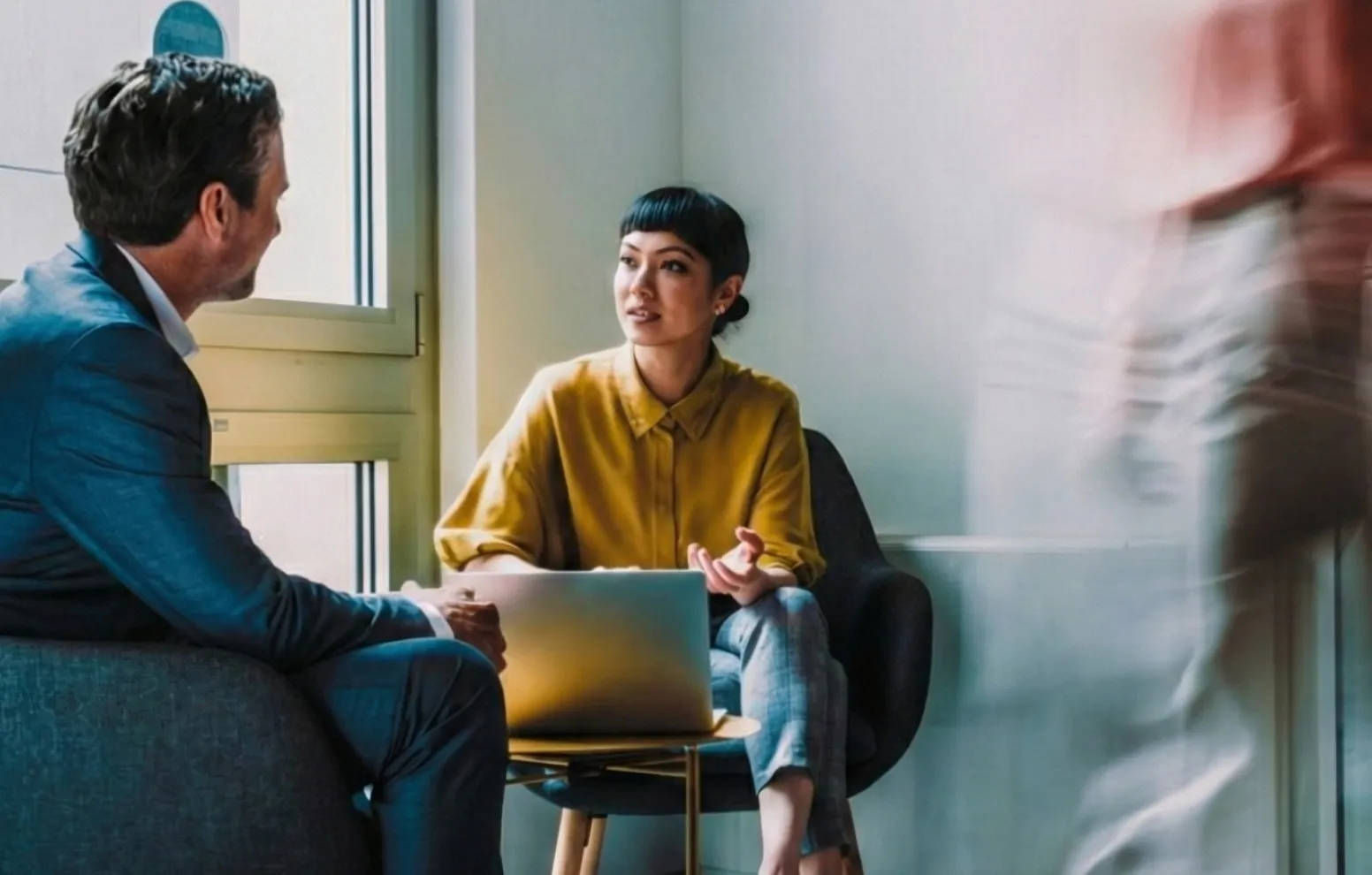 Two people reviewing customer feedback on a phone