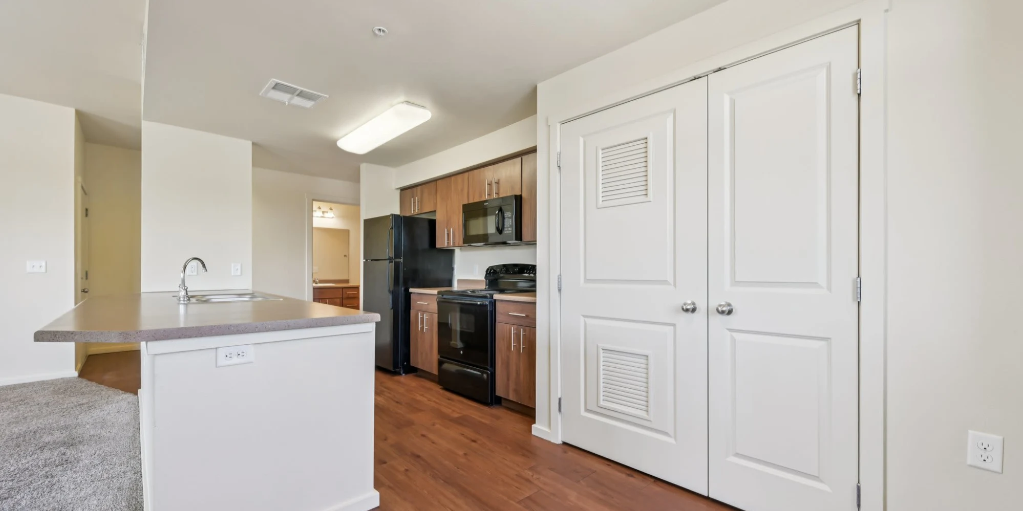 Kitchen with cupboard in view