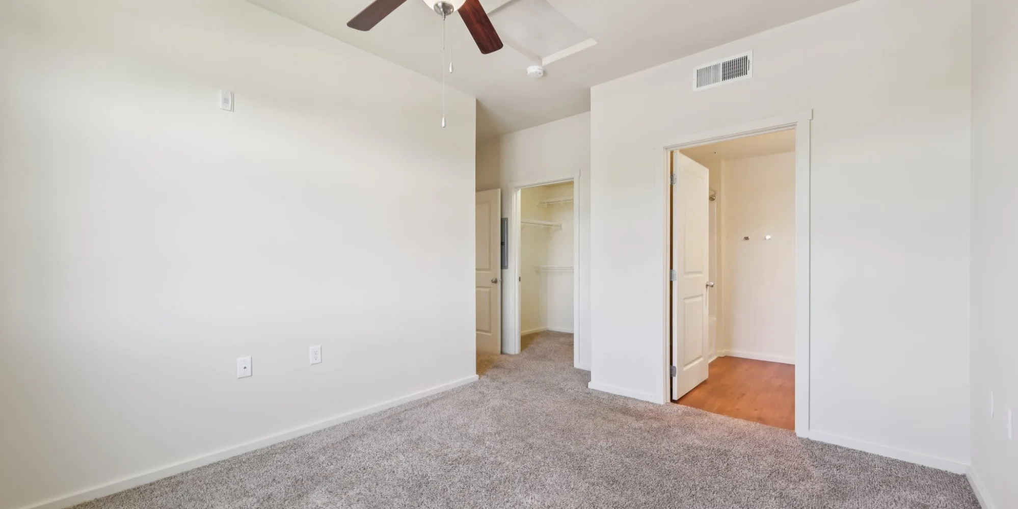 Bedroom with closet and bathroom view