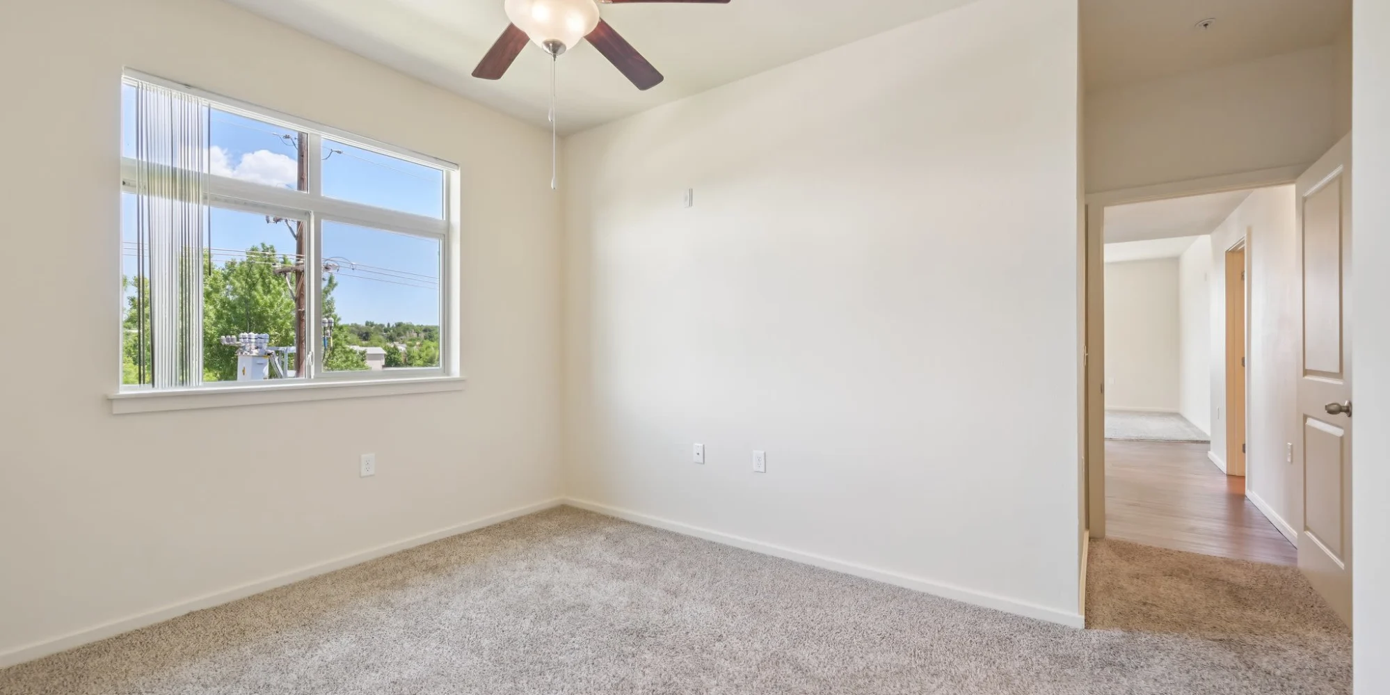 Bedroom with window and ceiling fan