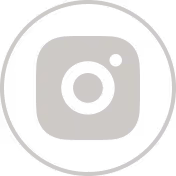Gray Instagram logo icon inside a circular border.
