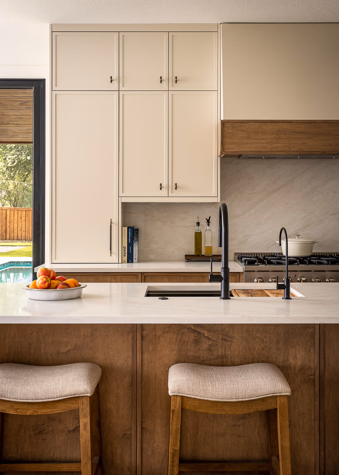 Kitchen with wooden cabinets, and white countertops.