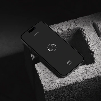 Mobile phone displaying the Aterra Estate logo on screen.