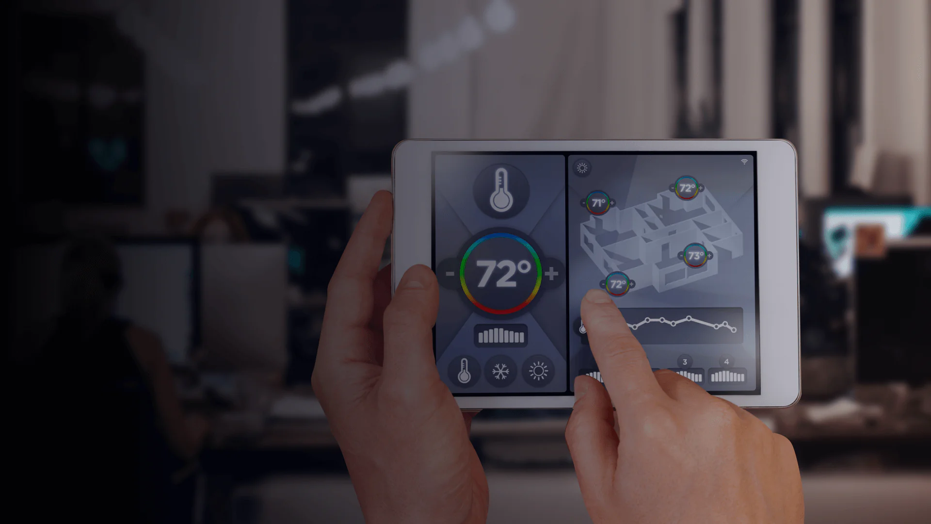 Close-up of hands using a tablet interface to monitor and adjust temperatures across a 3D floorplan.