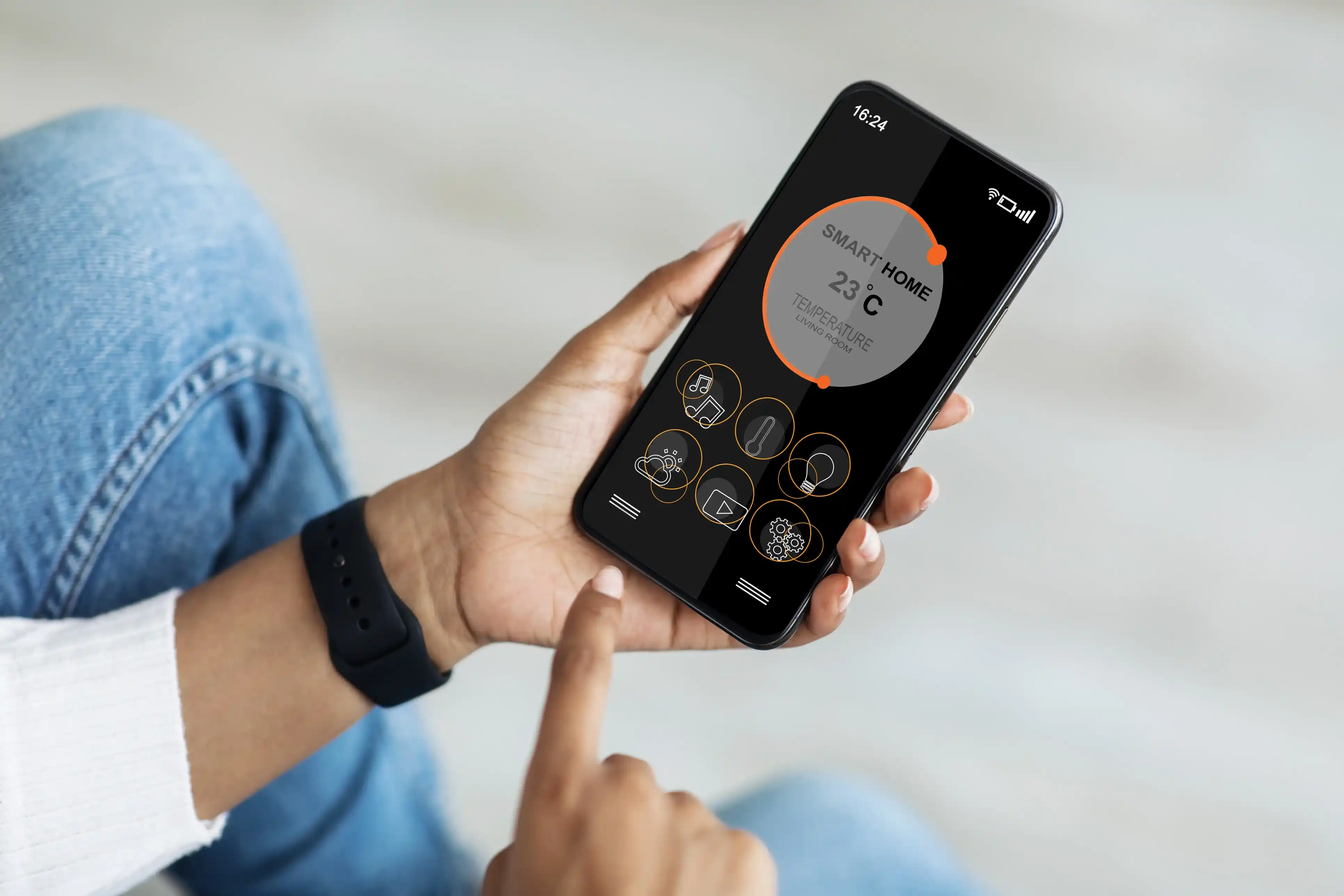 Close-up of a smart home app showing a 23°C temperature setting.