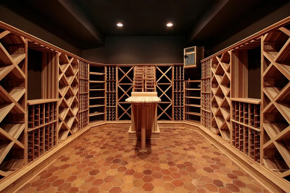 Custom wooden wine cellar shelving installation.