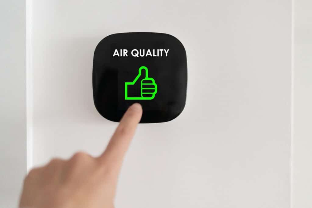 Wall mounted digital air quality monitor.