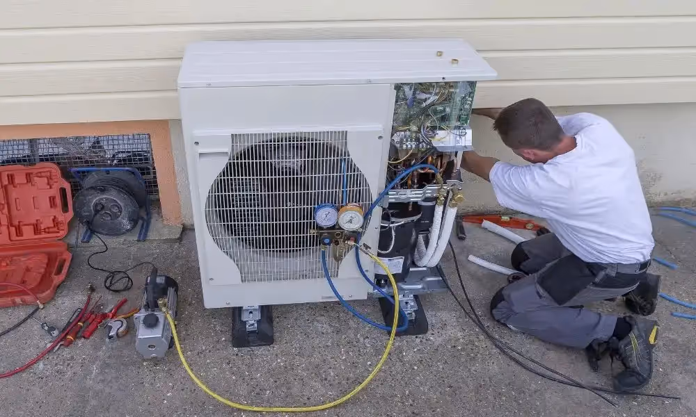 Technician installing an outdoor unit.