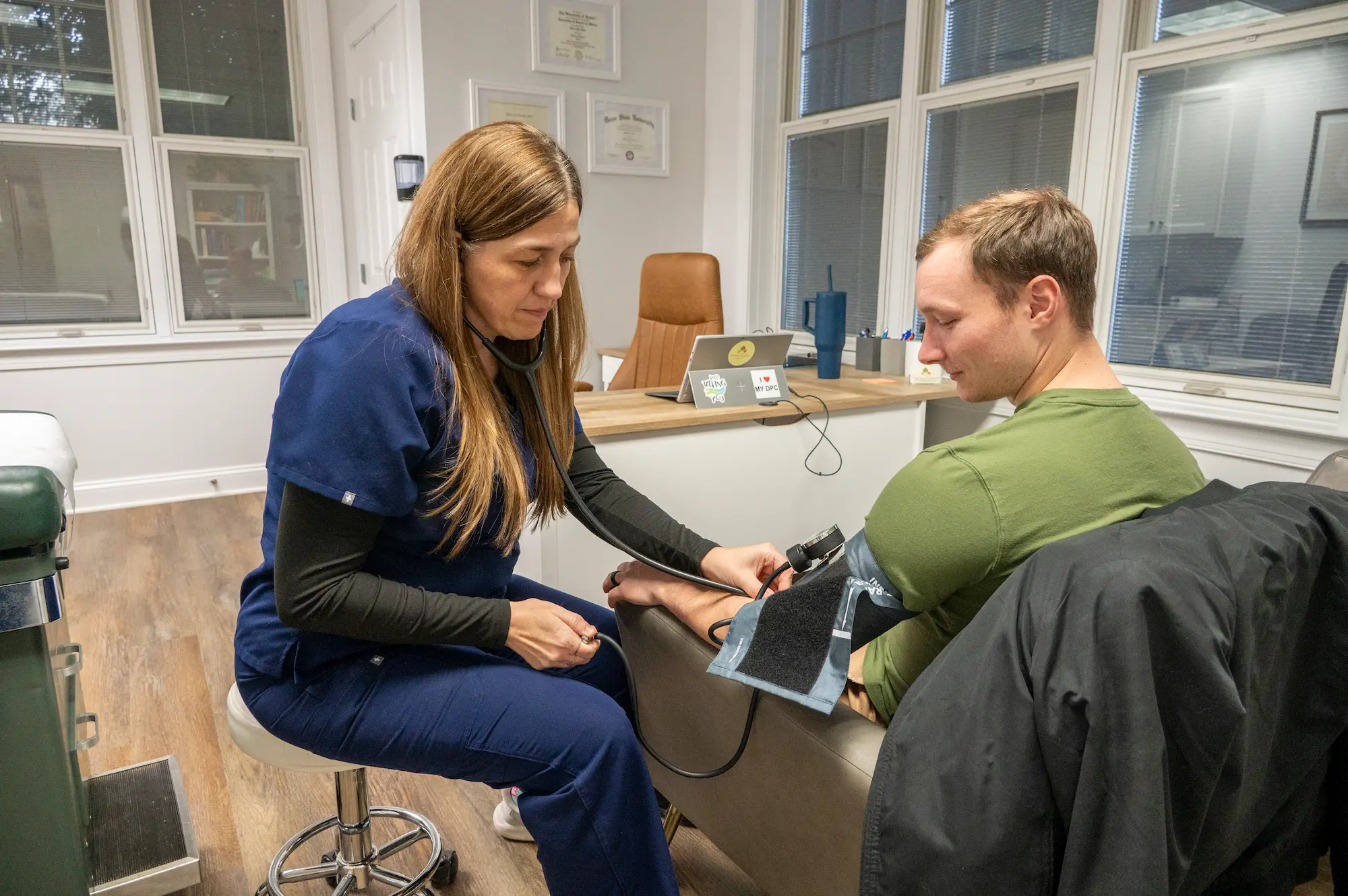 an image of a healthcare provider checking a man's blood pressure