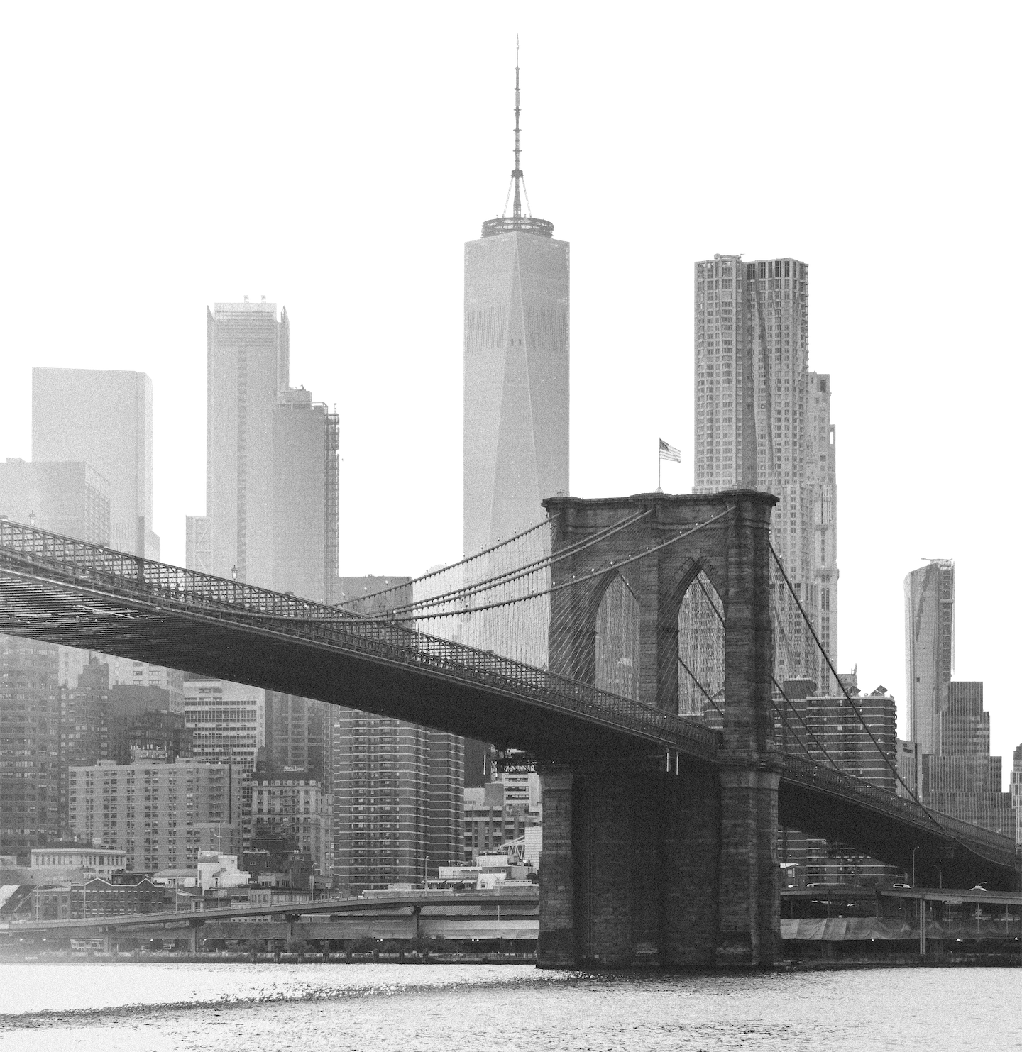 A black and white photo of the brooklyn bridge.