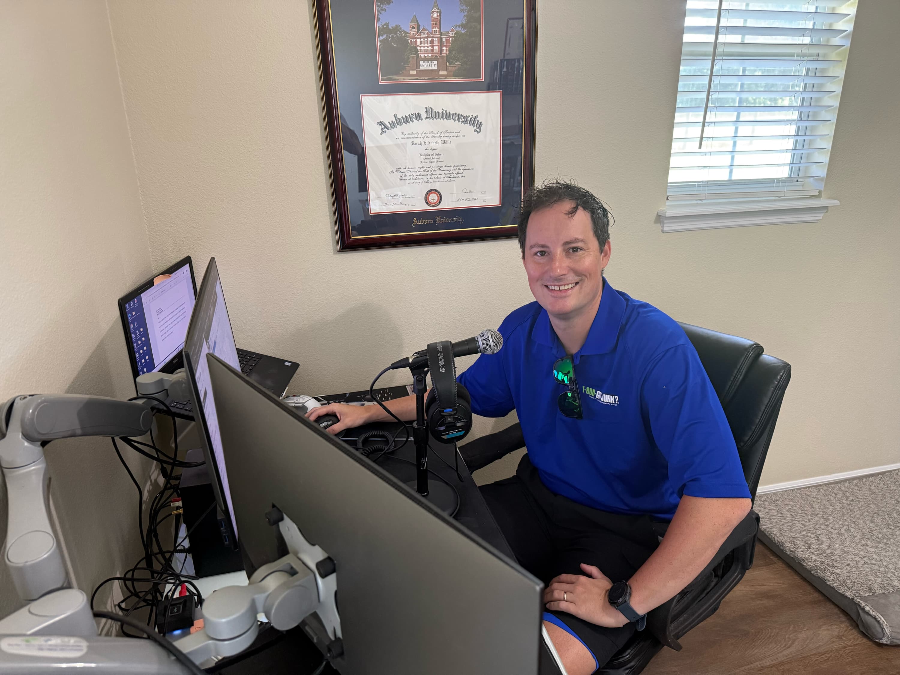 Florida-based radio announcer and content creator, Nick Fox, sitting at his desk as he creates content for his Millennial Inheritance Community.
