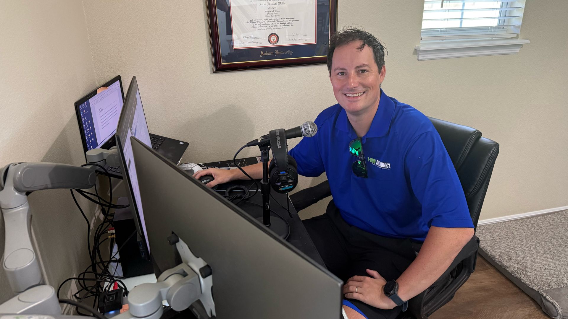 Florida-based radio announcer and content creator, Nick Fox, sitting at his desk as he creates content for his Millennial Inheritance Community.